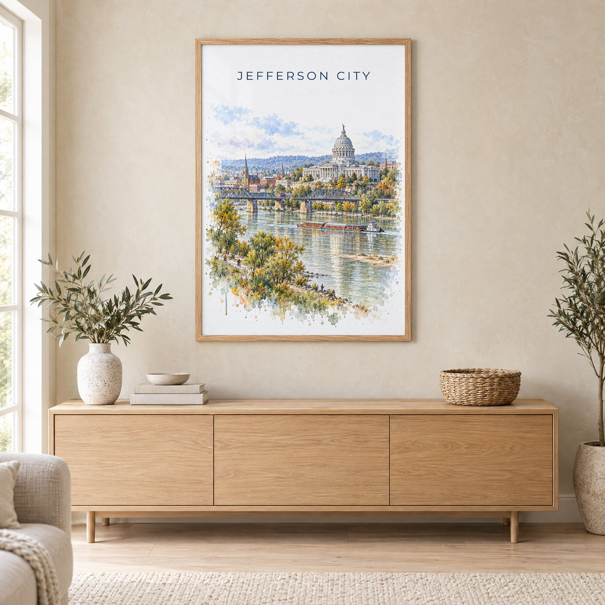 Jefferson City watercolor print in an oak frame above a light wood sideboard in a Scandinavian living room