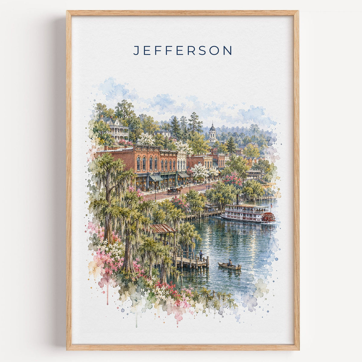 Jefferson, Texas watercolor print in a light oak frame on a plain white wall