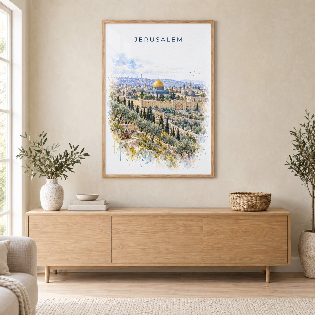 Jerusalem watercolor print in an oak frame above a light wood sideboard in a Scandinavian living room