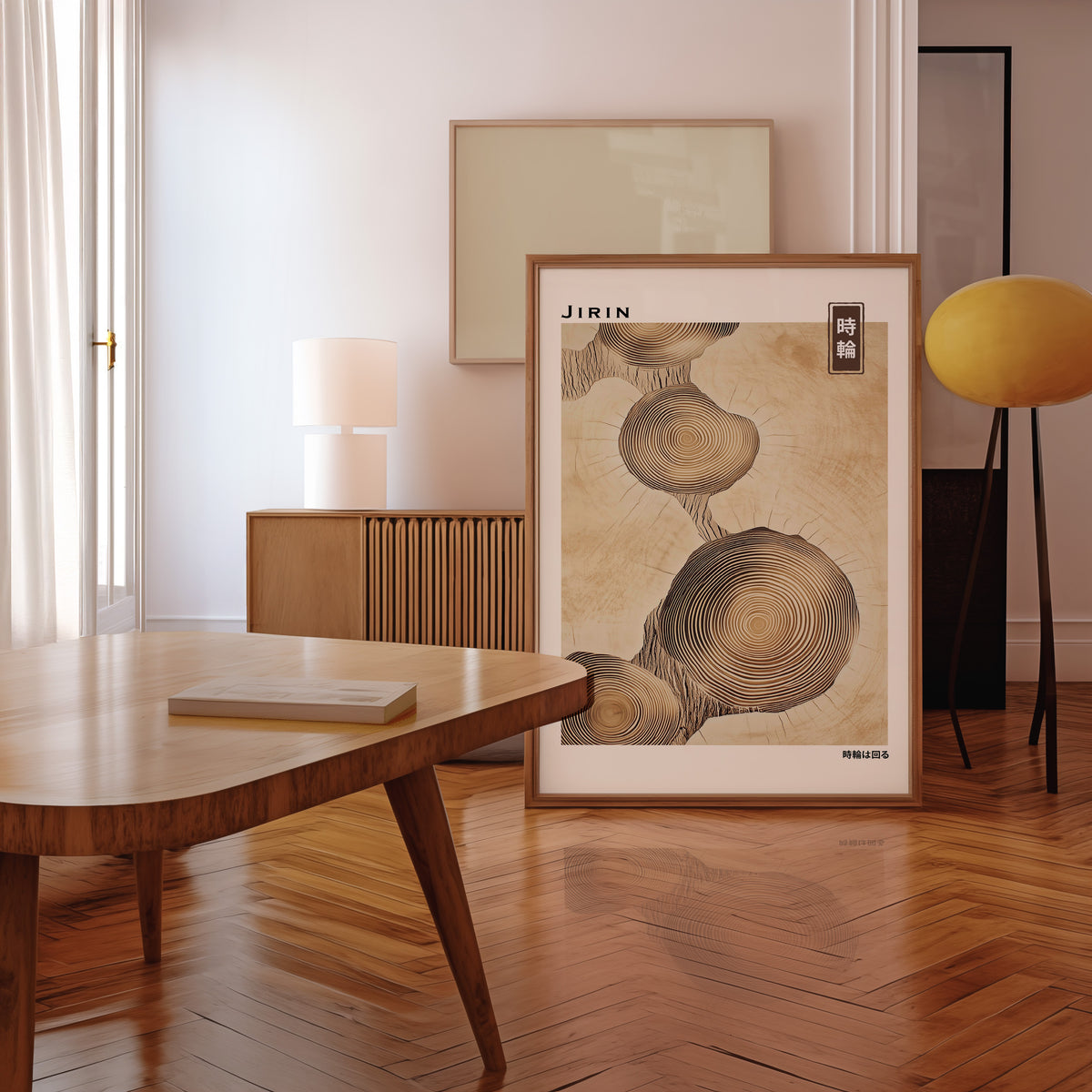 Stacked beige tree ring slices print in a walnut frame leaning in a mid-century living room