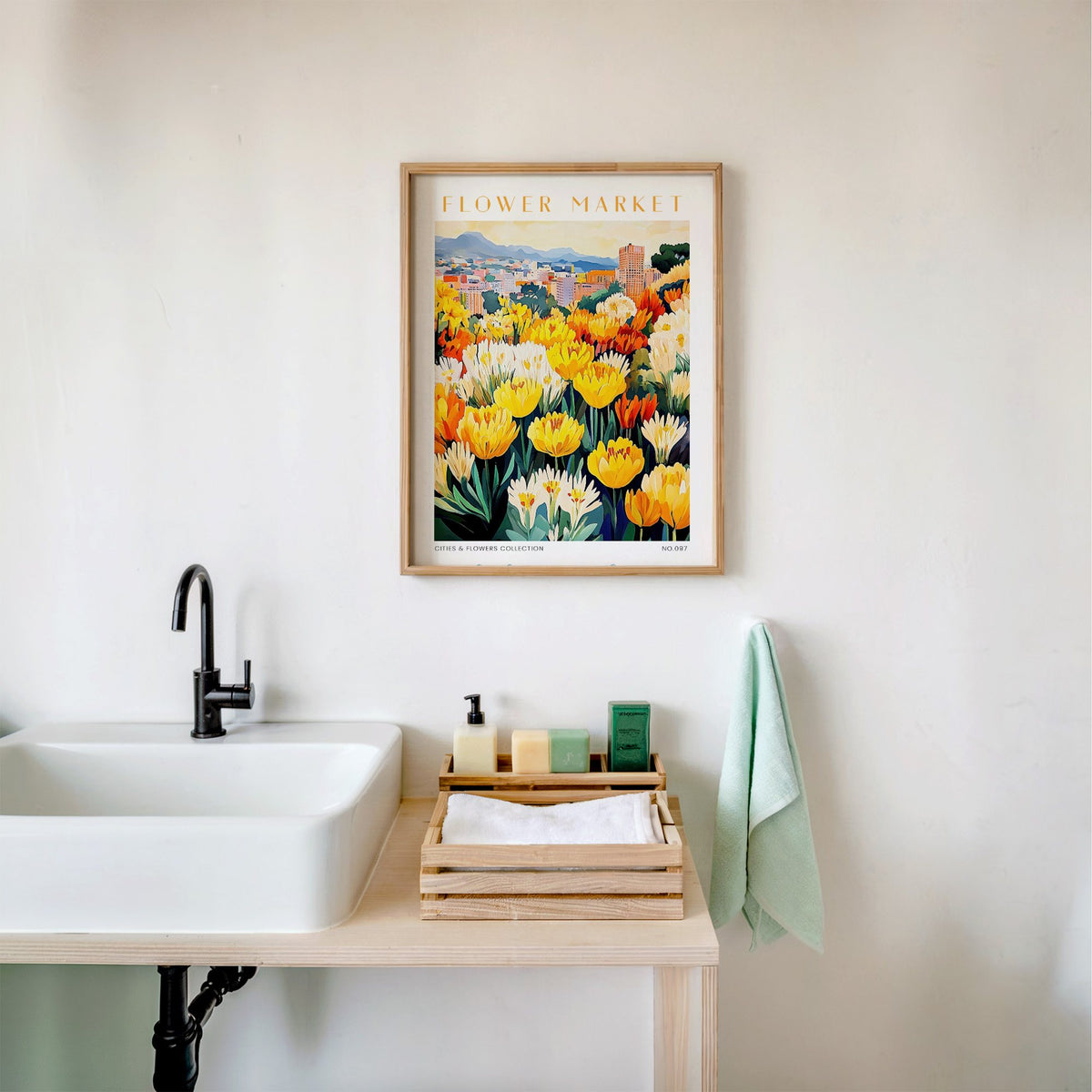 Johannesburg flower market print in an oak frame above a white bathroom sink with folded towels