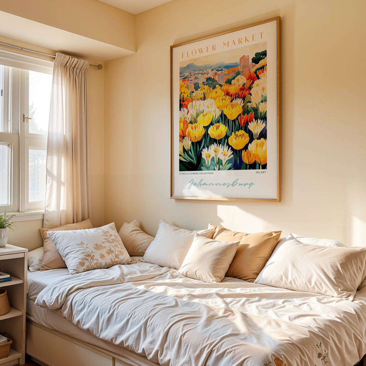 Johannesburg flower market print in an oak frame above a cream daybed in a sunny bedroom