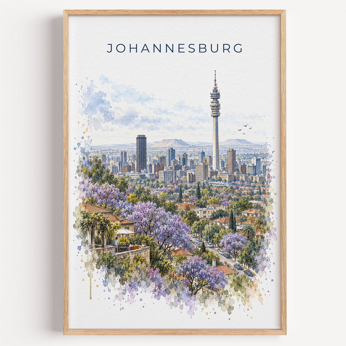 Johannesburg watercolor print in a light oak frame on a plain white wall