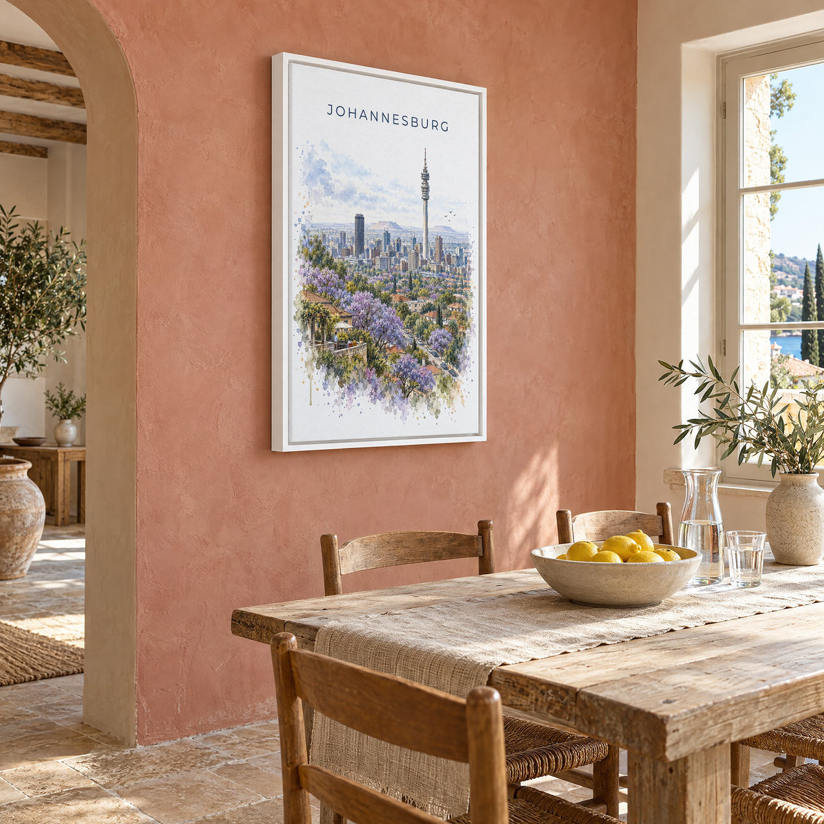 Johannesburg watercolor print as a white floater canvas on a terracotta wall above a rustic dining table