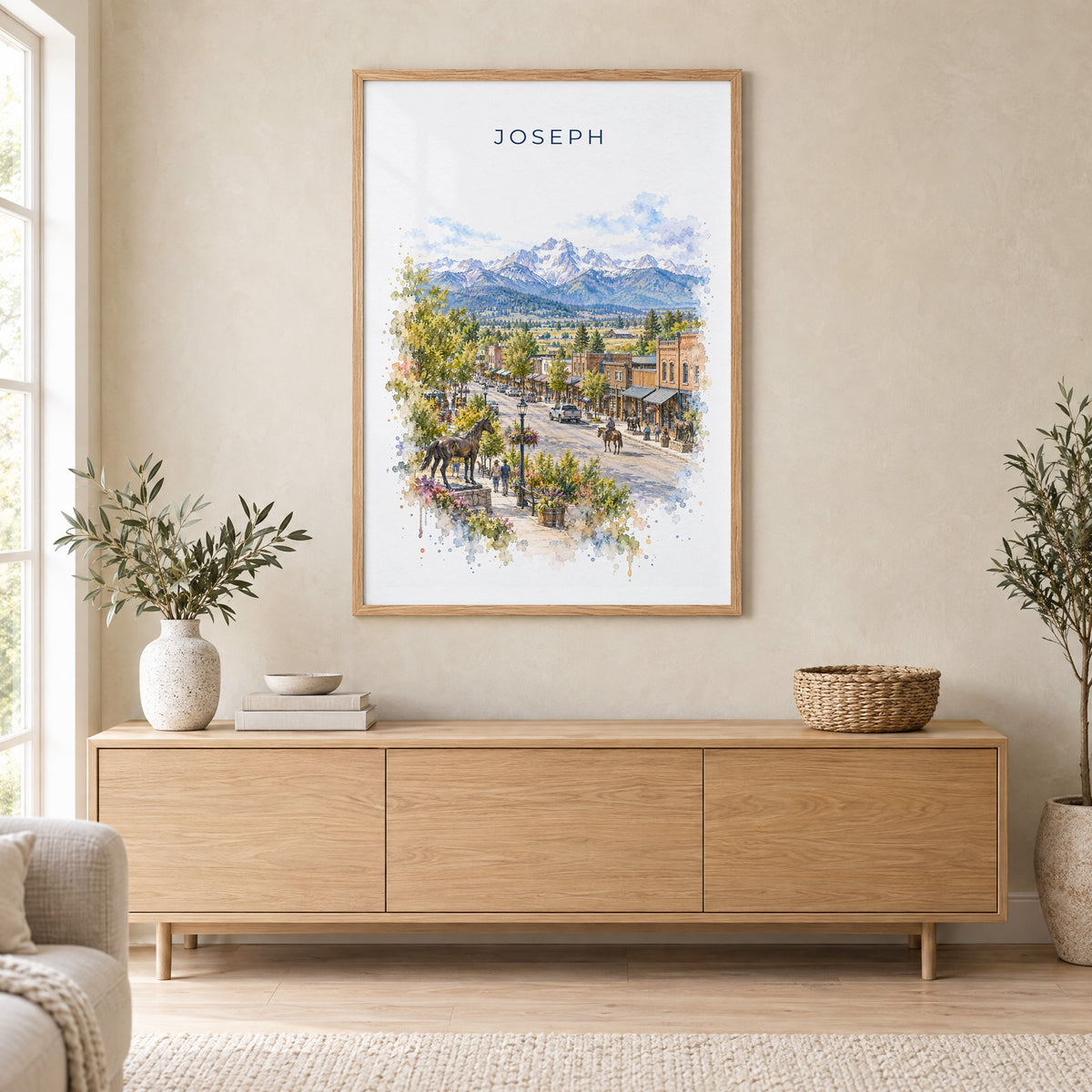 Joseph, Oregon watercolor print in an oak frame above a light wood sideboard in a Scandinavian living room
