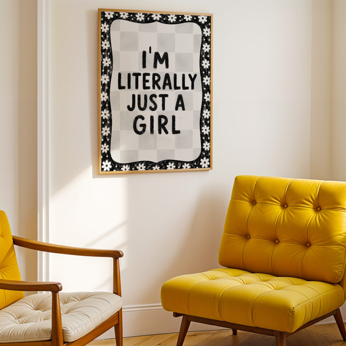 I'm literally just a girl quote with daisy border print shown in a gold frame above a mustard yellow tufted armchair