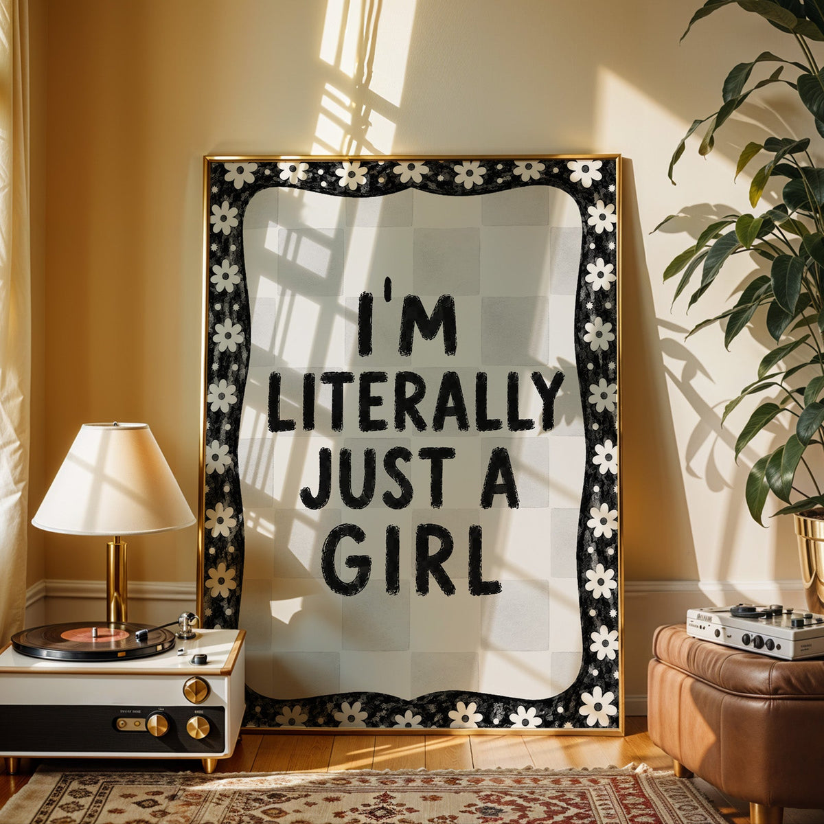 I'm literally just a girl quote with daisy border print shown in a gold frame beside a record player and table lamp