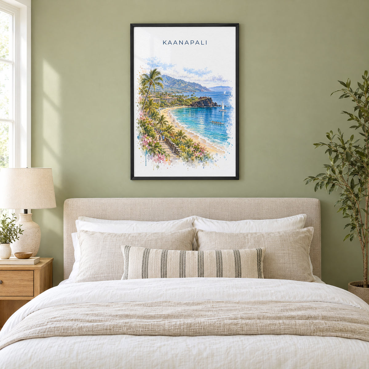Kaanapali watercolor print in a black frame above an upholstered headboard in a sage green bedroom