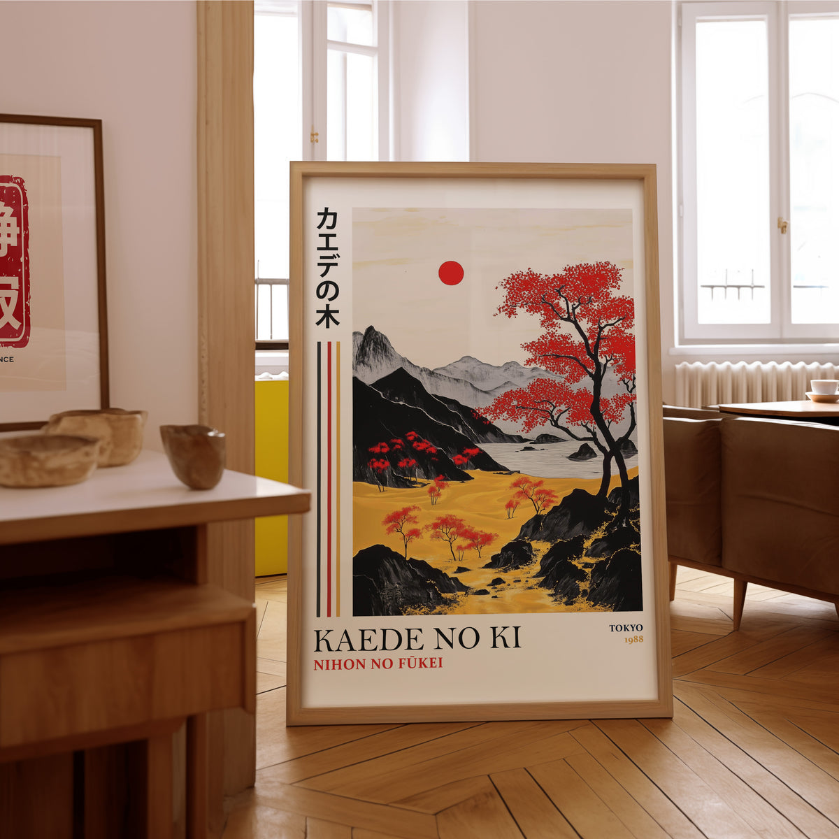 Kaede red maple tree landscape print in an oak frame on the parquet floor of a sunlit living room