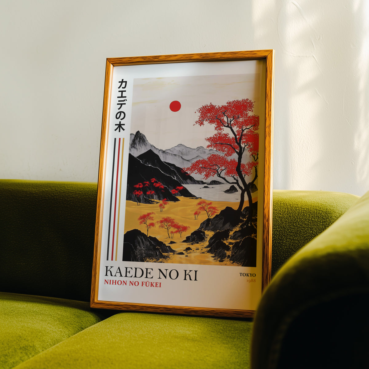 Kaede red maple tree landscape print in an oak frame propped on a green velvet sofa
