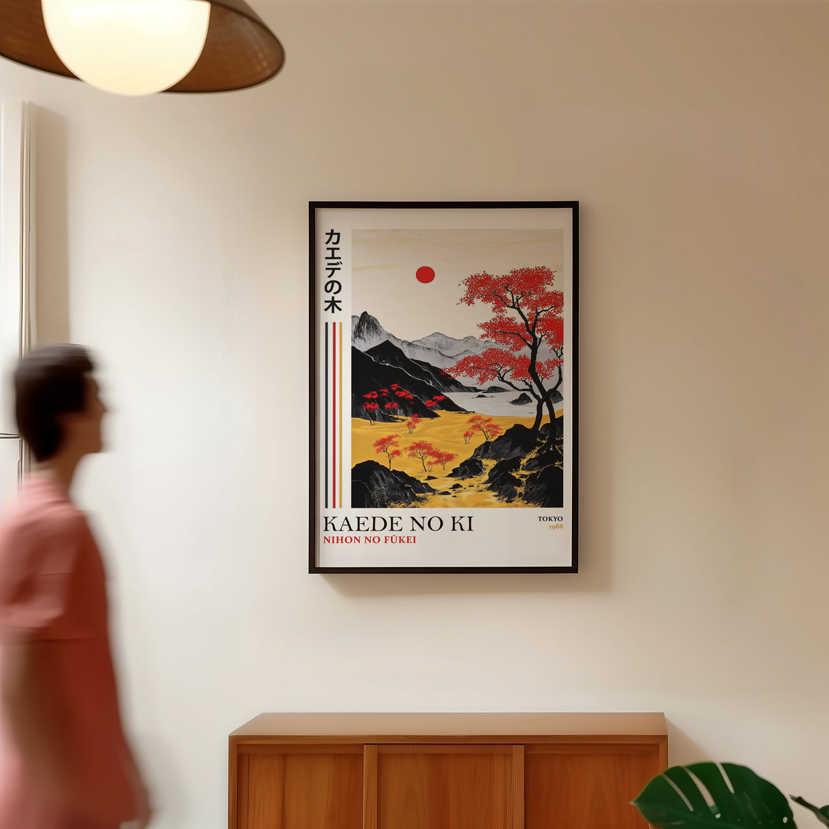 Kaede red maple tree landscape print in a black frame in a hallway under a rattan pendant