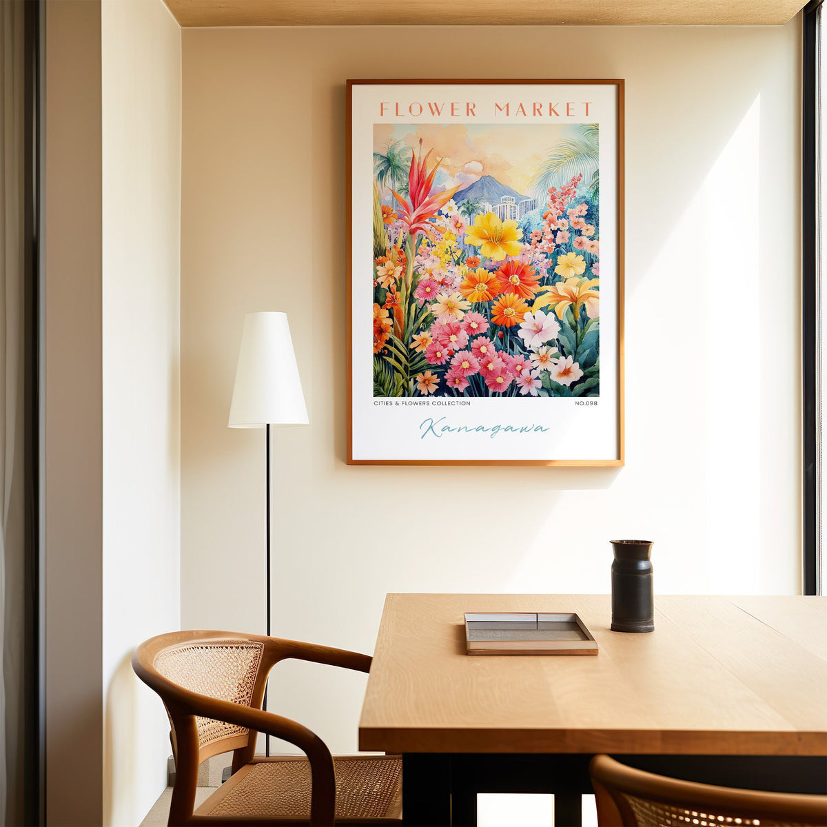 Kanagawa flower market print in an oak frame above a dining table and cane chair