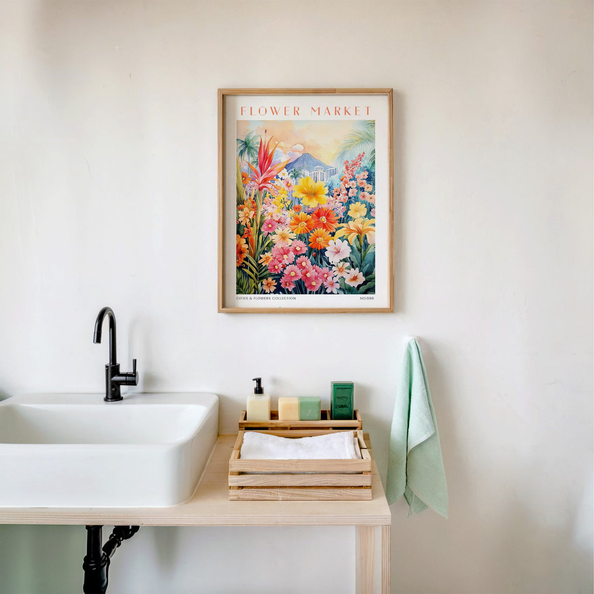 Kanagawa flower market print in an oak frame above a white bathroom sink with folded towels