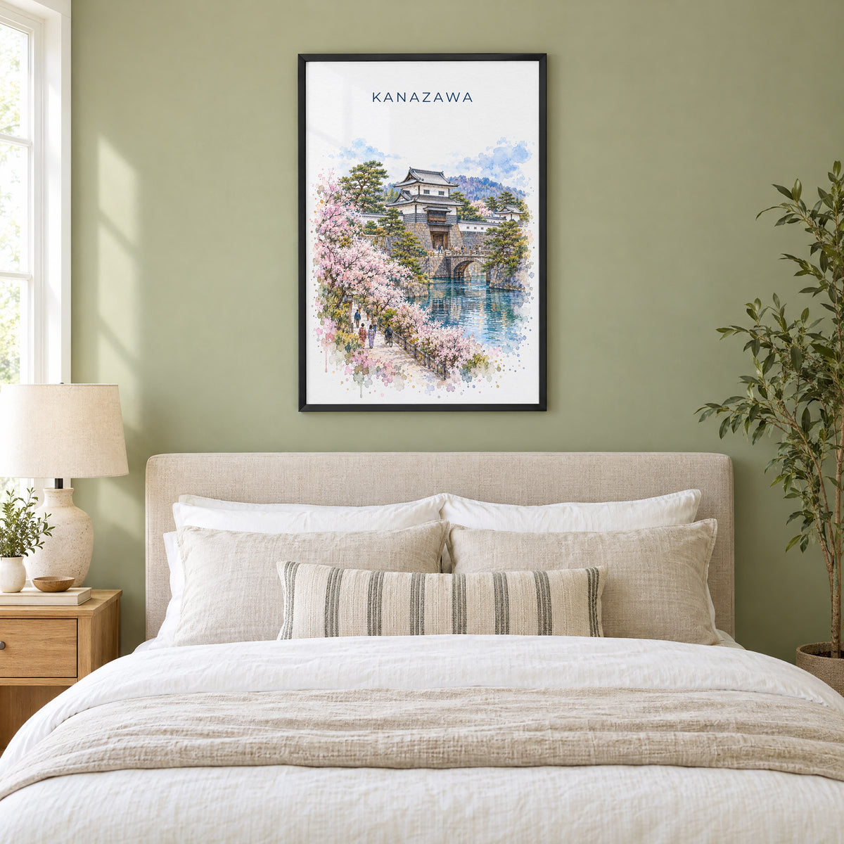 Kanazawa watercolor print in a black frame above an upholstered headboard in a sage green bedroom