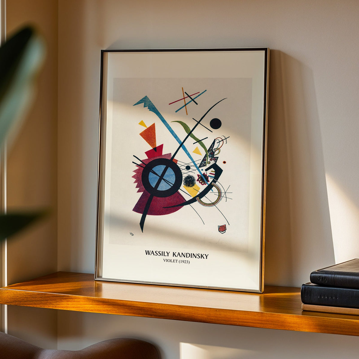 Violet abstract print in a black frame on a walnut shelf in evening light