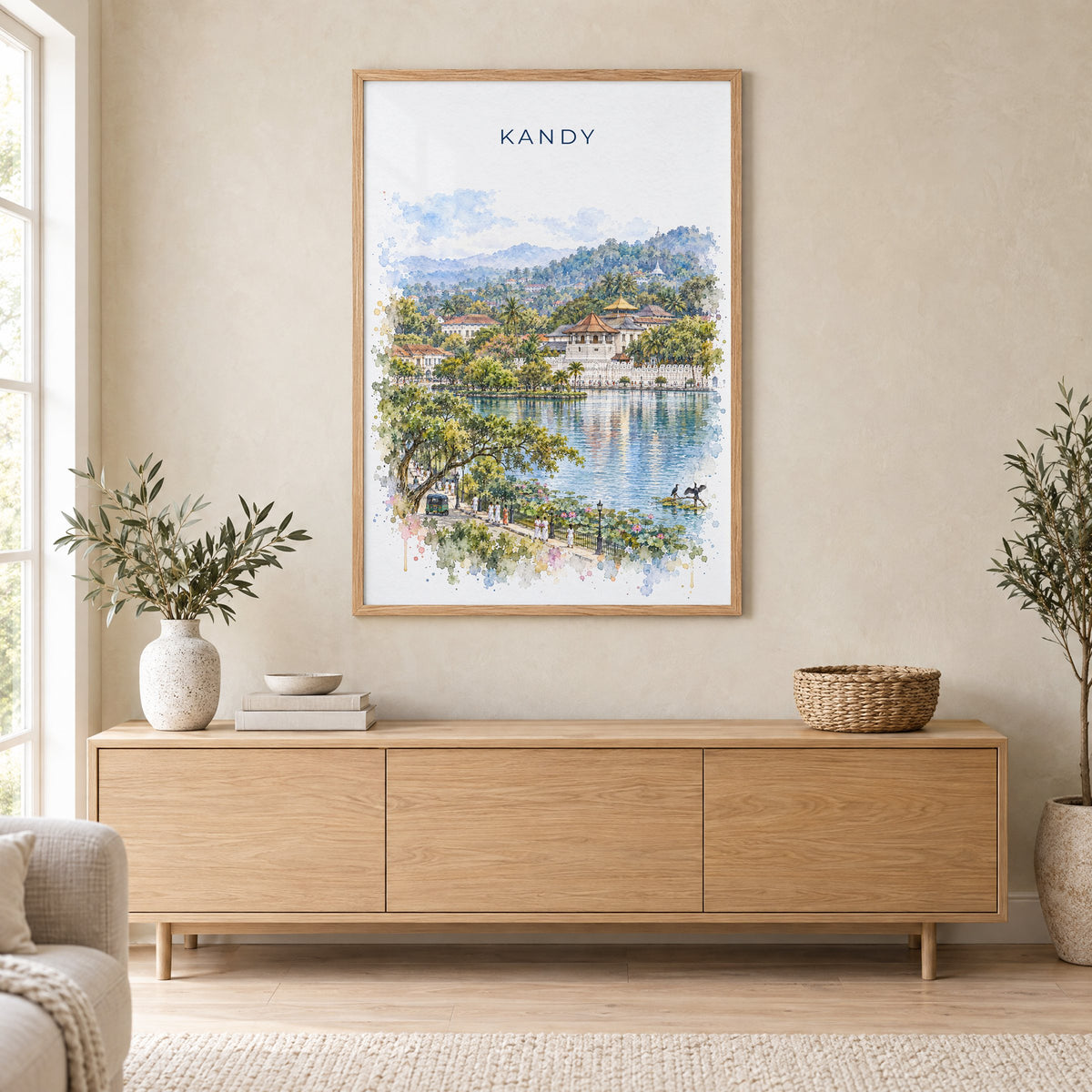 Kandy, Sri Lanka watercolor print in an oak frame above a light wood sideboard in a Scandinavian living room