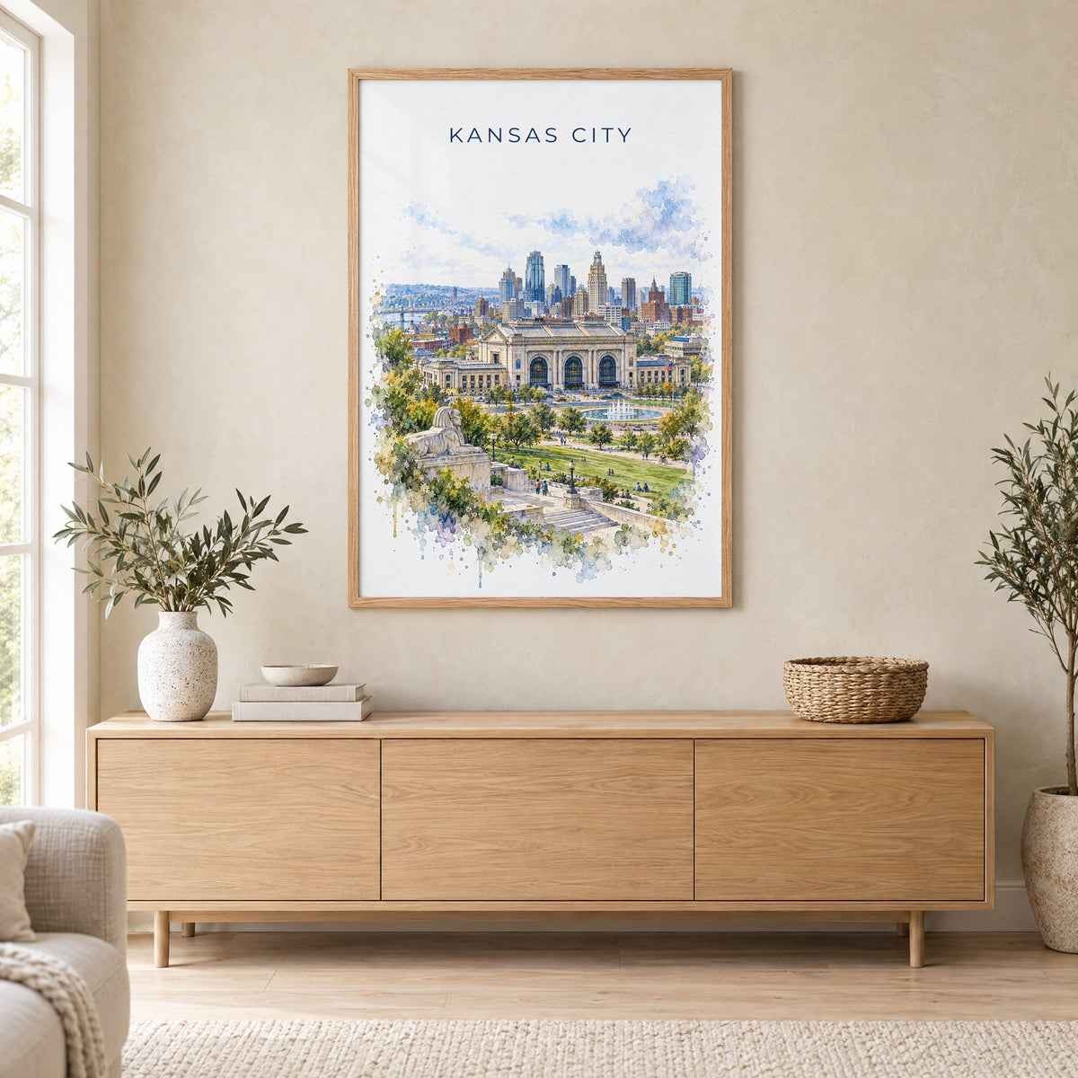 Kansas City watercolor print in an oak frame above a light wood sideboard in a Scandinavian living room