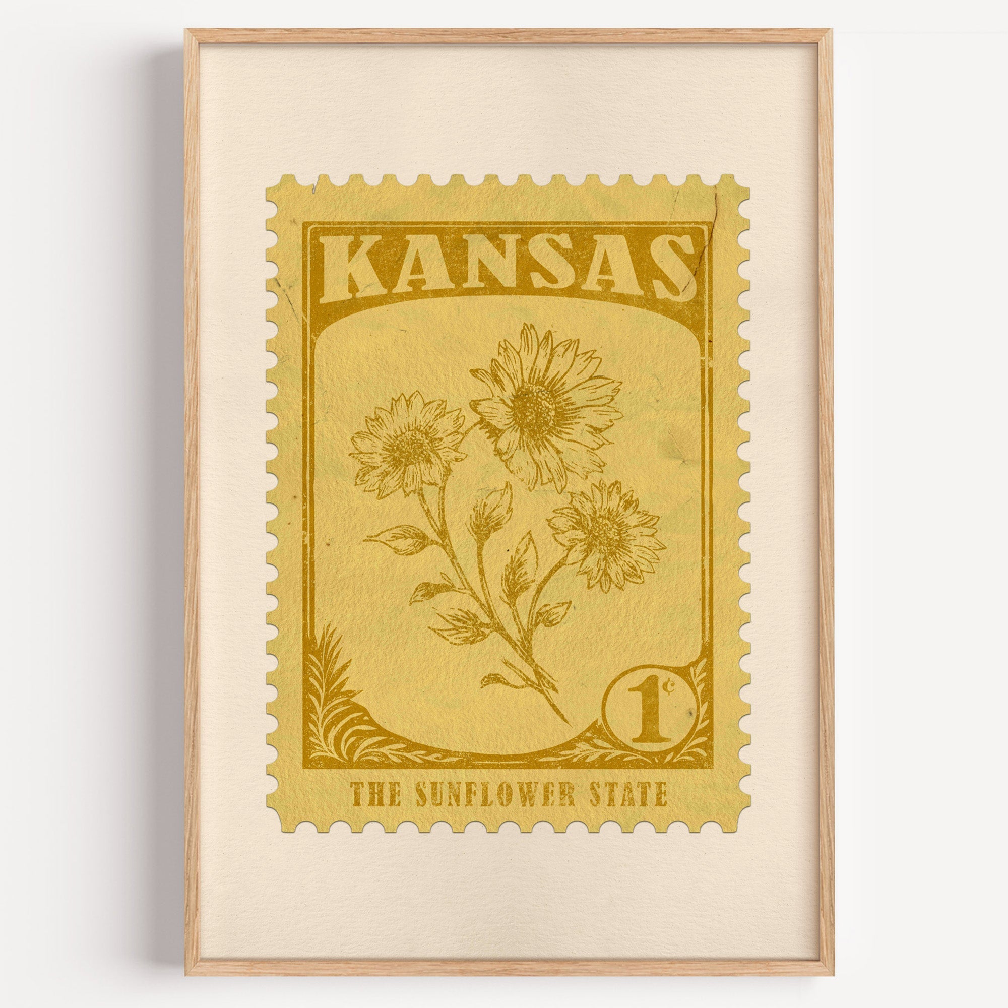Kansas state flower stamp print in ochre gold on straw, light oak frame on a plain white wall
