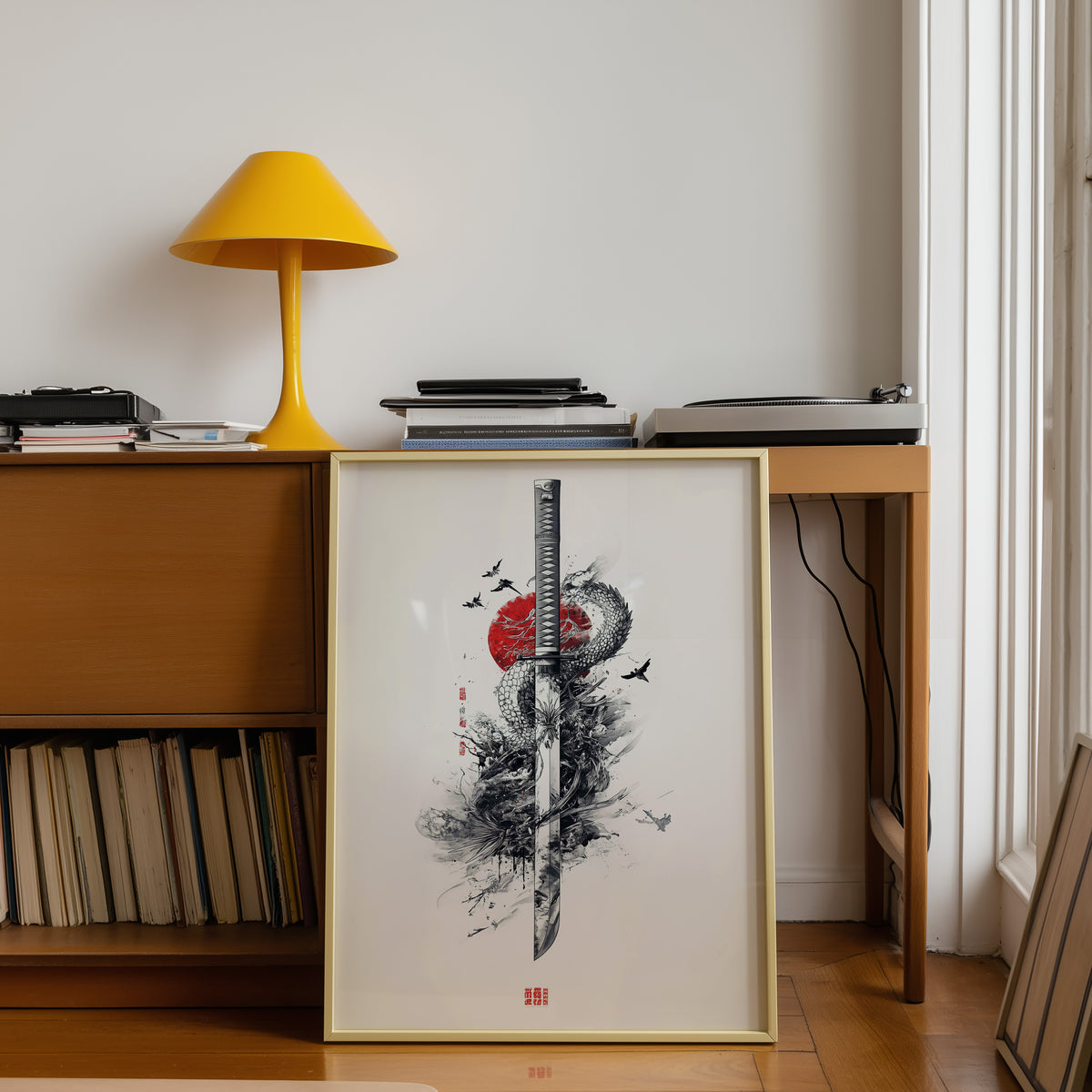 Ink dragon coiled around katana print shown in a gold frame below a teak desk with a yellow lamp