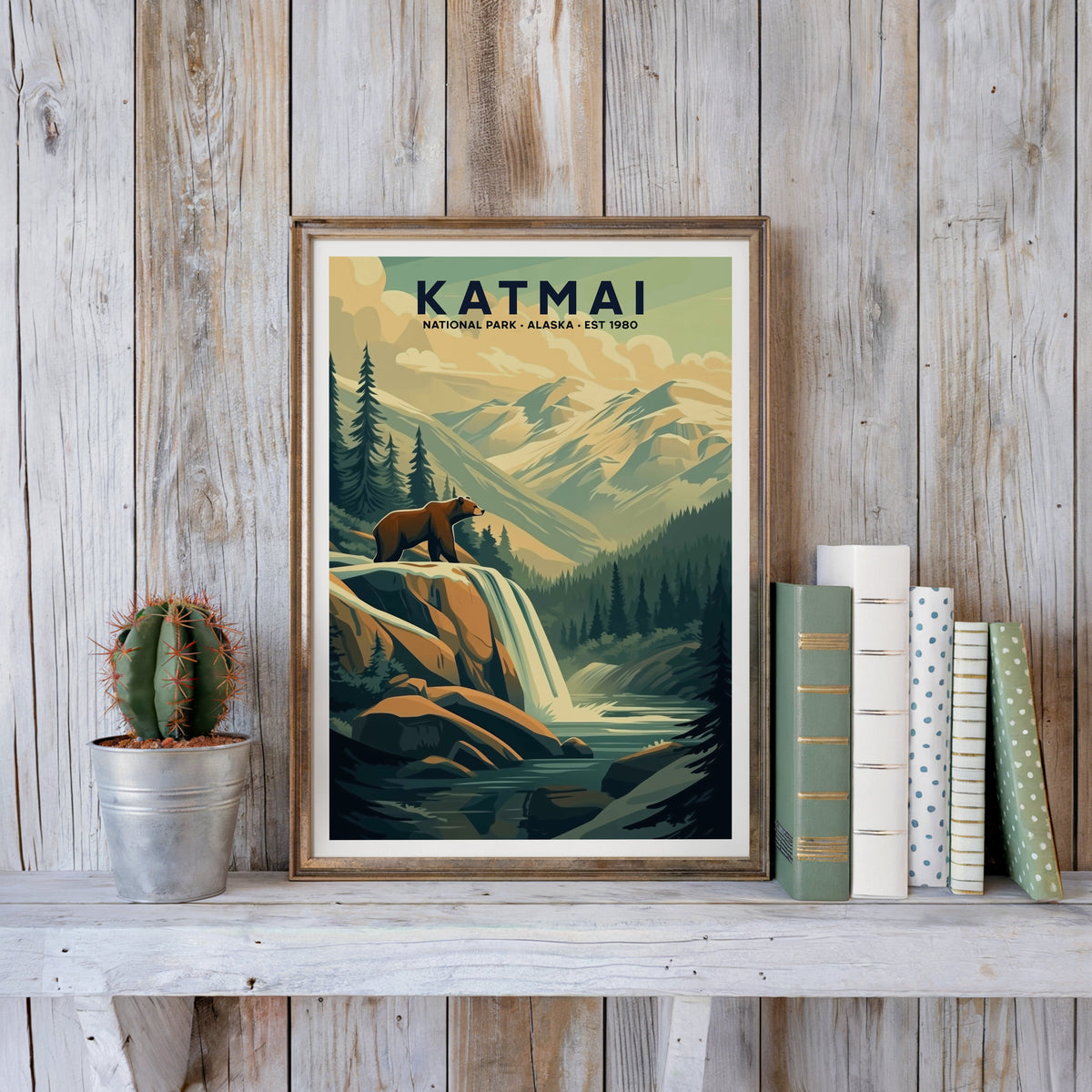 Katmai poster in an antique gold frame against whitewashed farmhouse planks beside books and a cactus