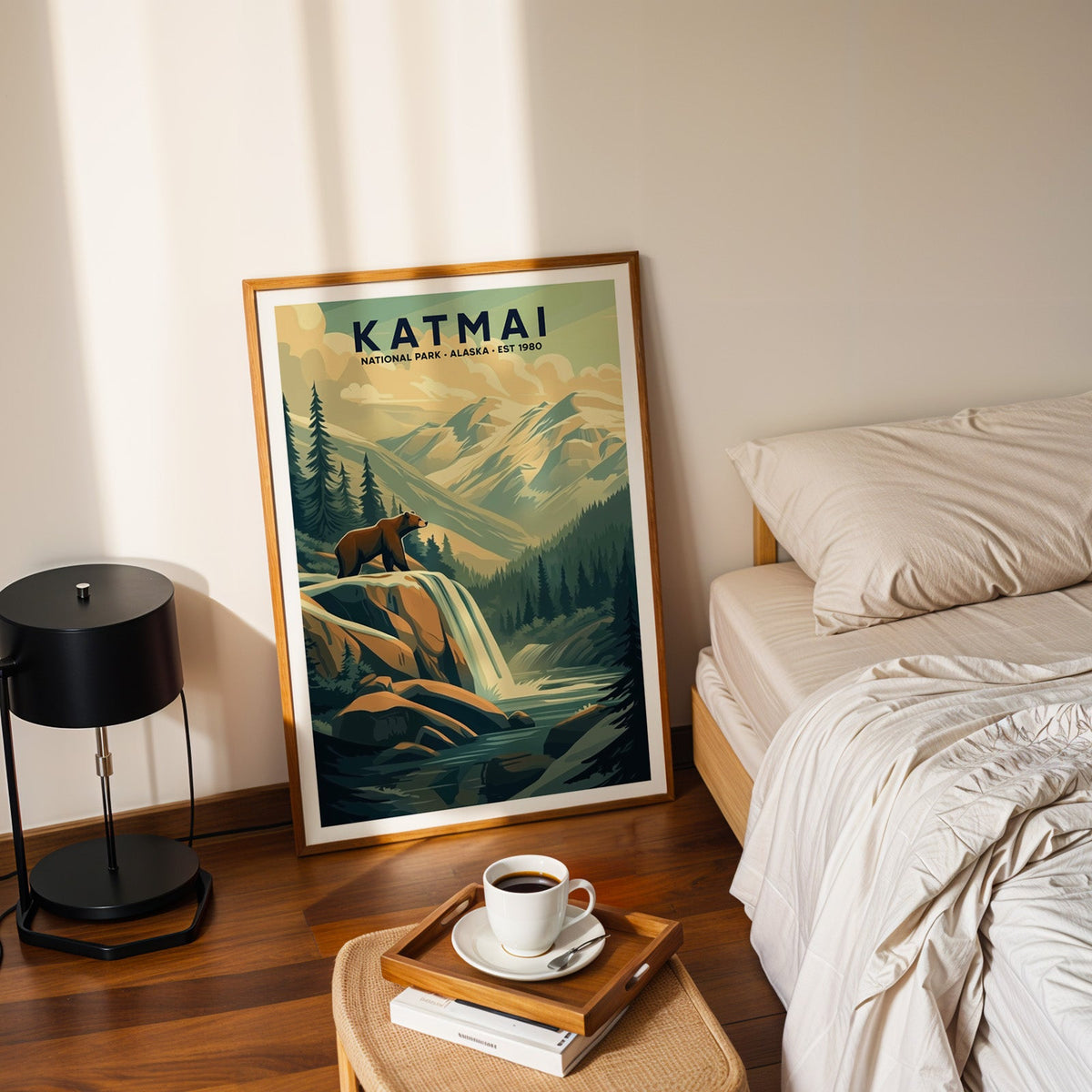 Katmai National Park print in an oak frame leaning on a bedroom floor beside the bed and a coffee tray