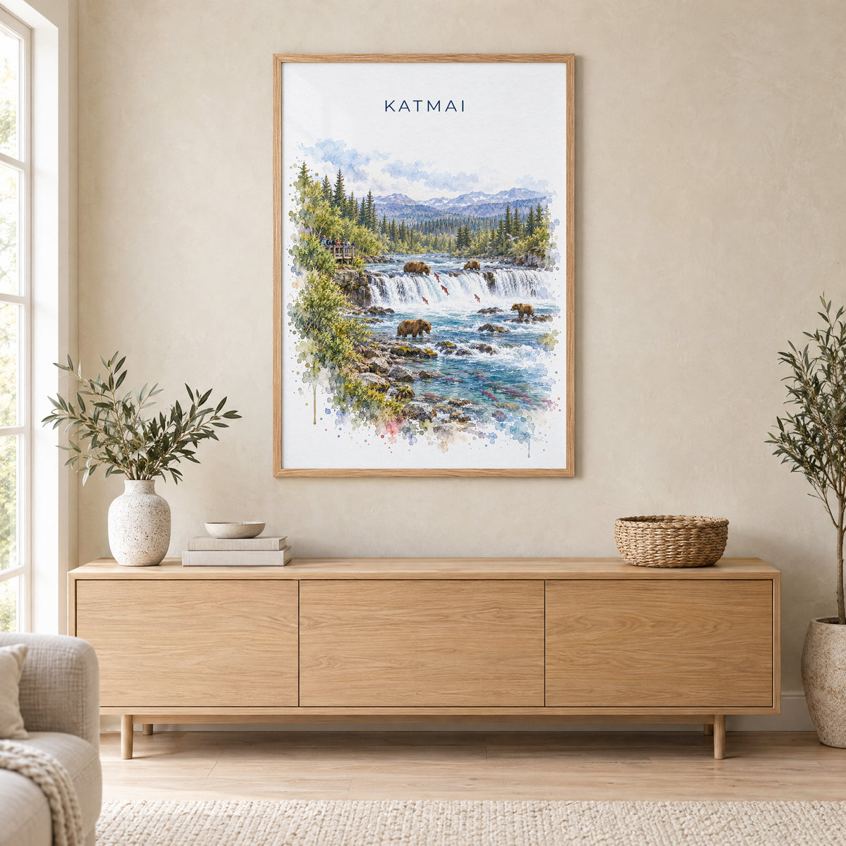 Katmai National Park watercolor print in an oak frame above a light wood sideboard in a Scandinavian living room