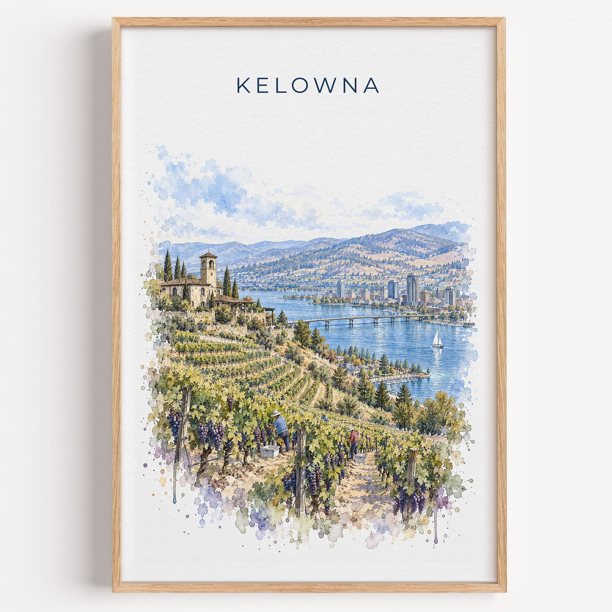 Kelowna watercolor print in a light oak frame on a plain white wall