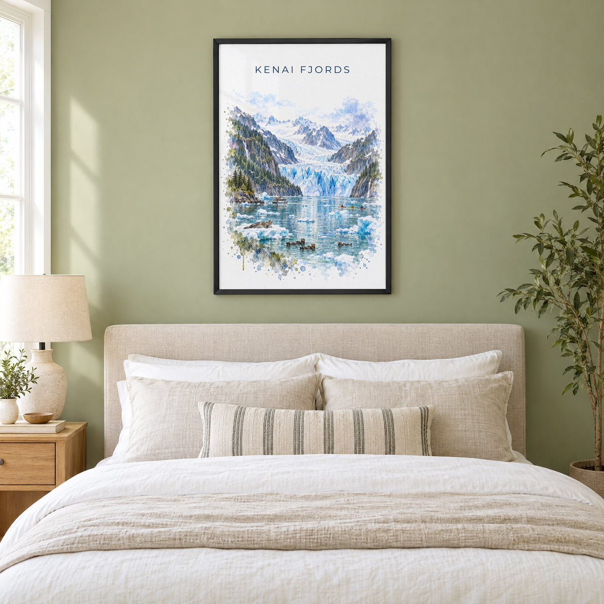 Kenai Fjords National Park watercolor print in a black frame above an upholstered headboard in a sage green bedroom