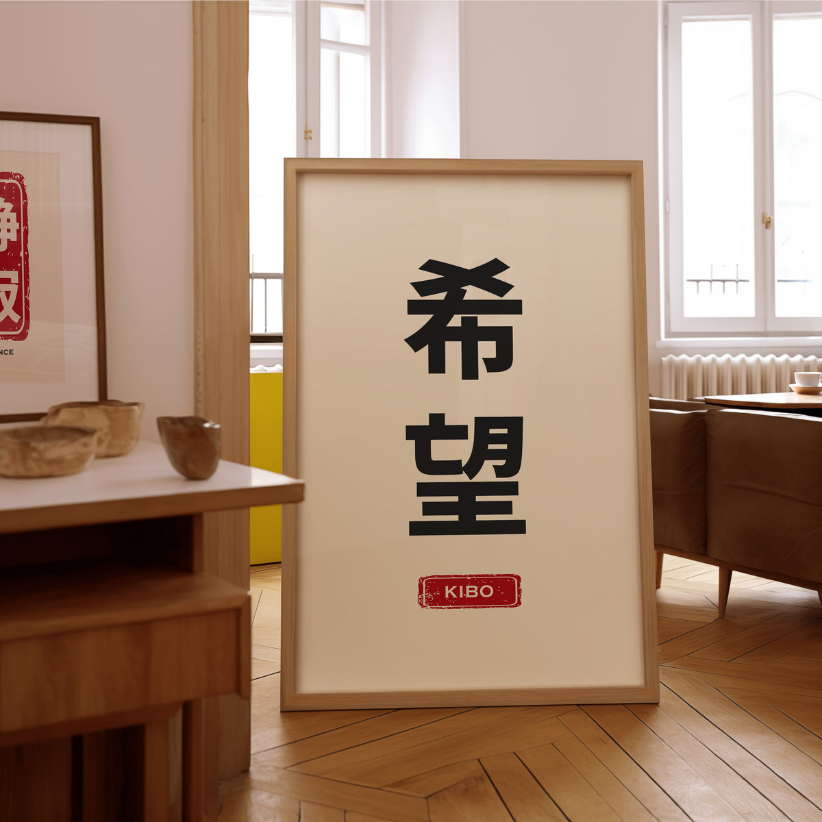 Kibo hope kanji red label print in an oak frame on the parquet floor of a sunlit living room
