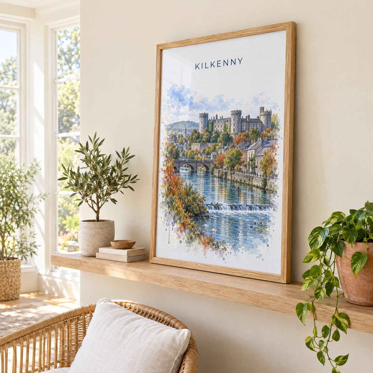 Kilkenny watercolor print in an oak frame on a picture ledge in a sunlit sunroom