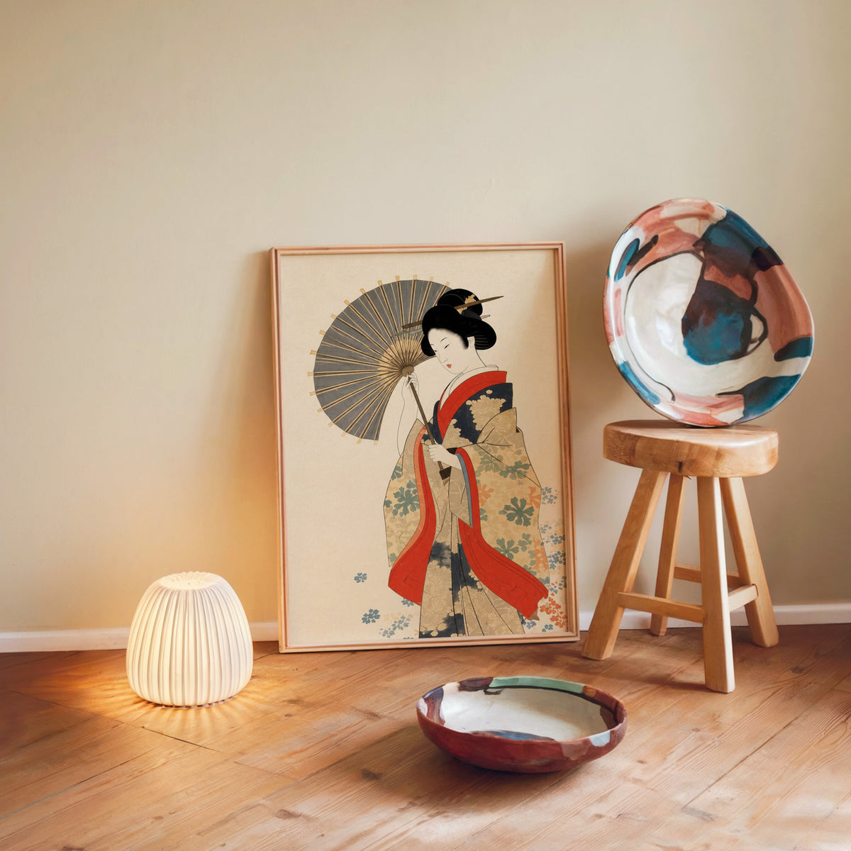 kimono woman with grey parasol print in a light wood frame leaning on a wooden floor by a glowing lamp and stool