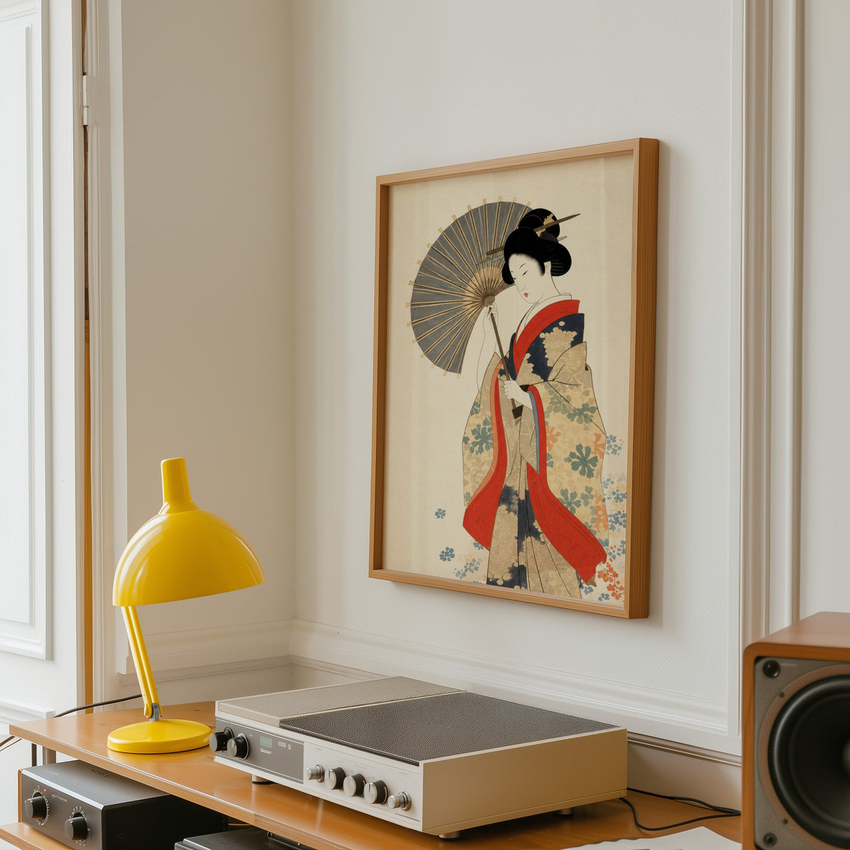 kimono woman with grey parasol print in an oak frame above a vintage hi-fi shelf with a yellow desk lamp