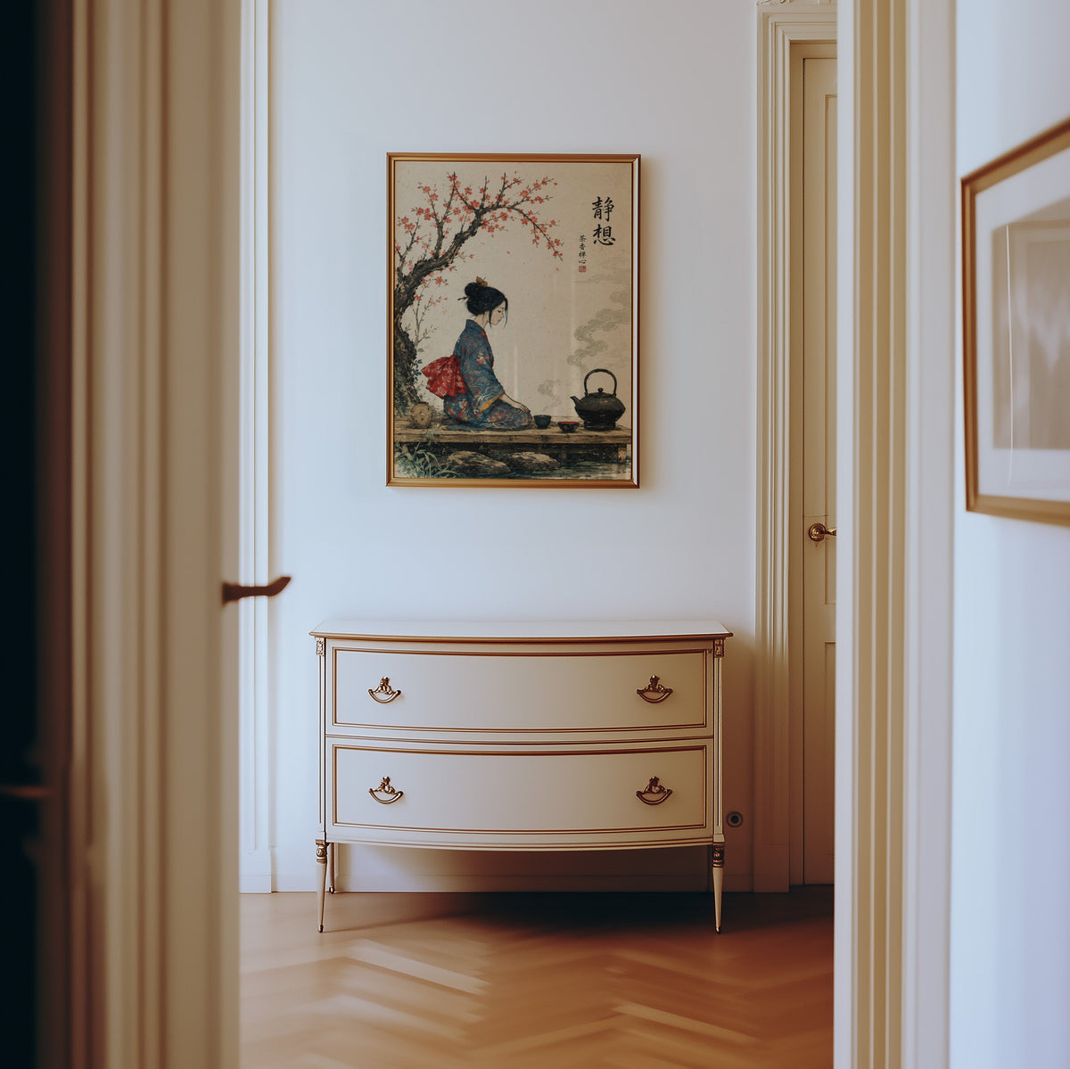 kimono woman with iron tea kettle print shown in a gold frame in a hallway above a cream dresser