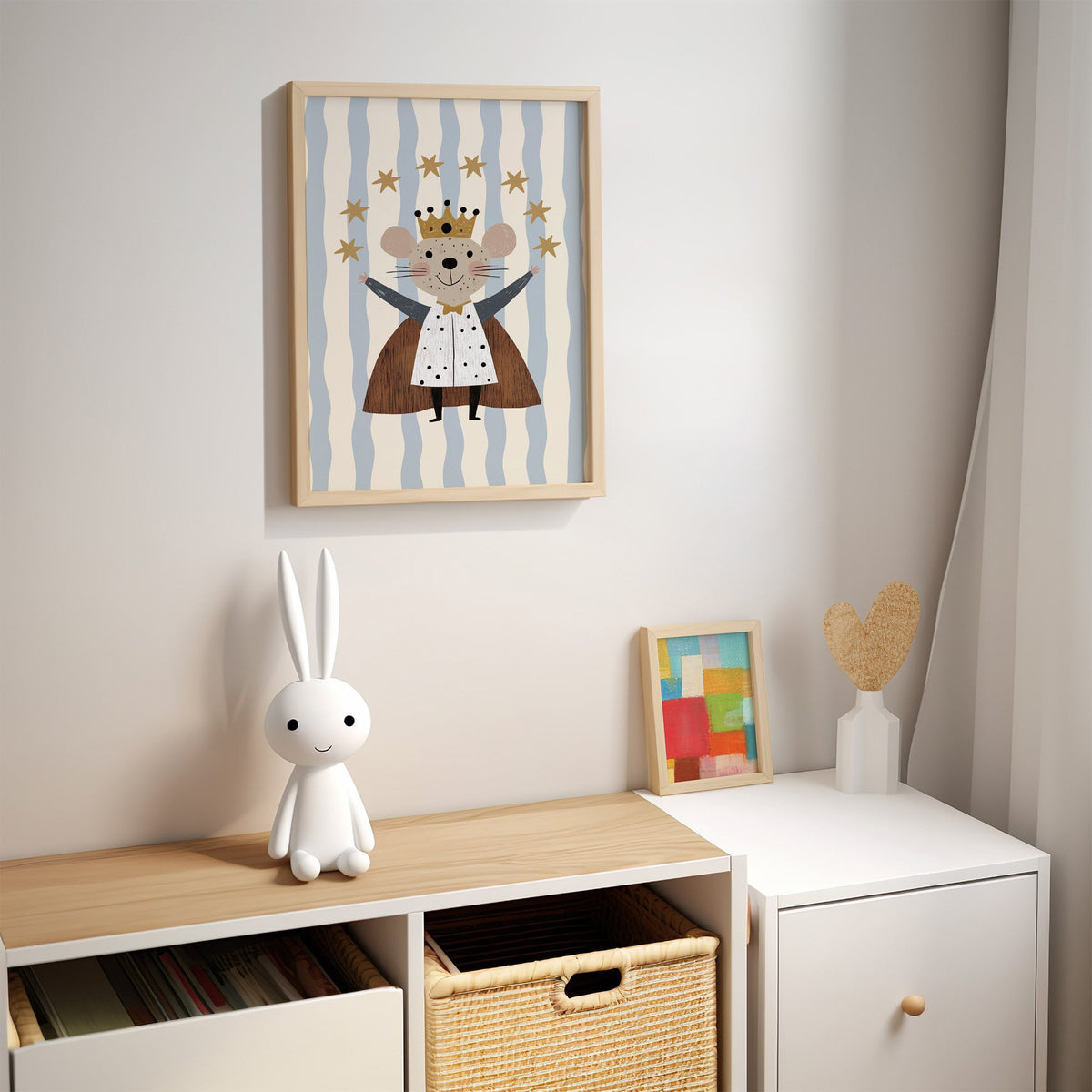 King mouse crown star arc nursery print in an oak frame above a kids cubby shelf with a woven basket and bunny lamp