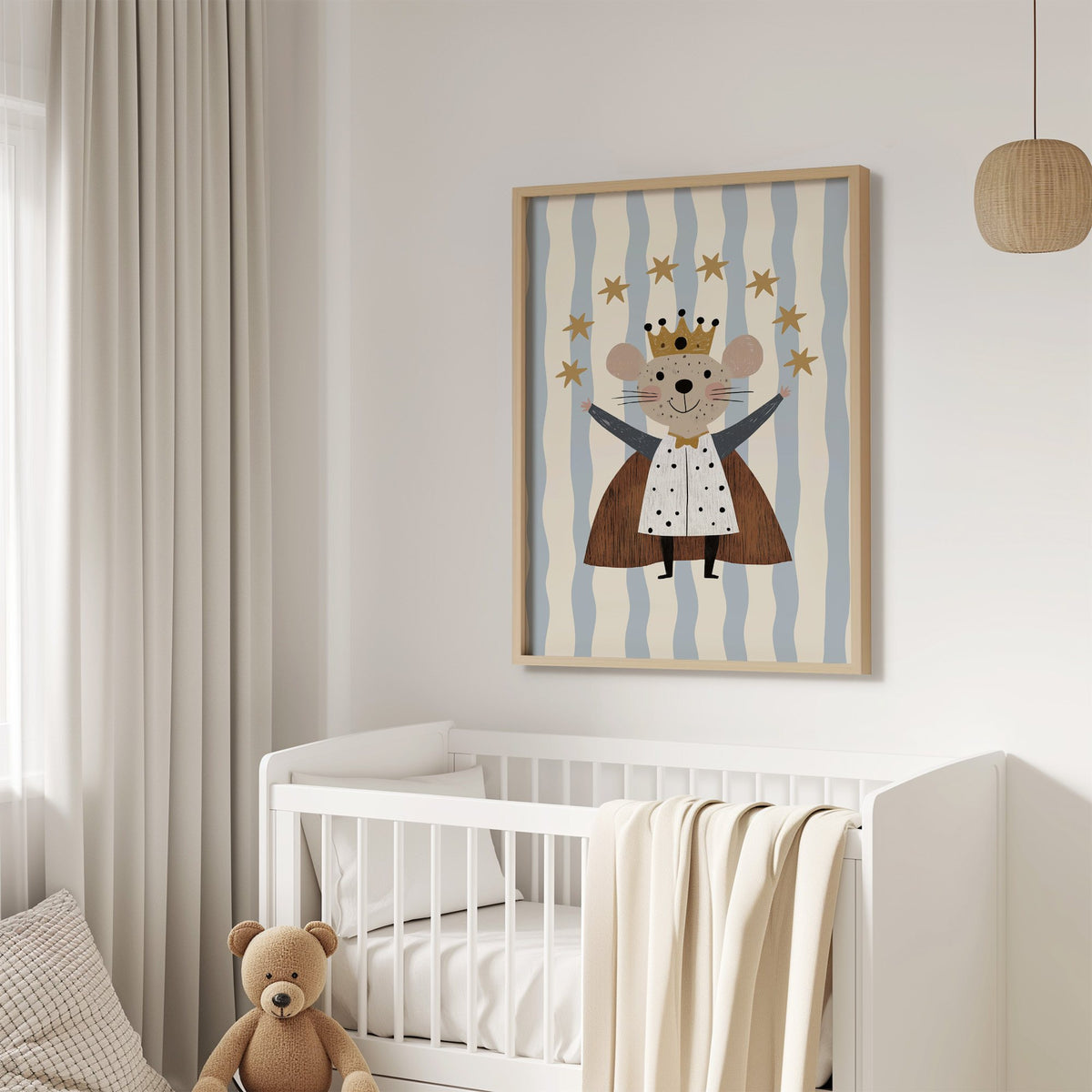 King mouse crown star arc nursery print in an oak frame above a white crib with a teddy bear