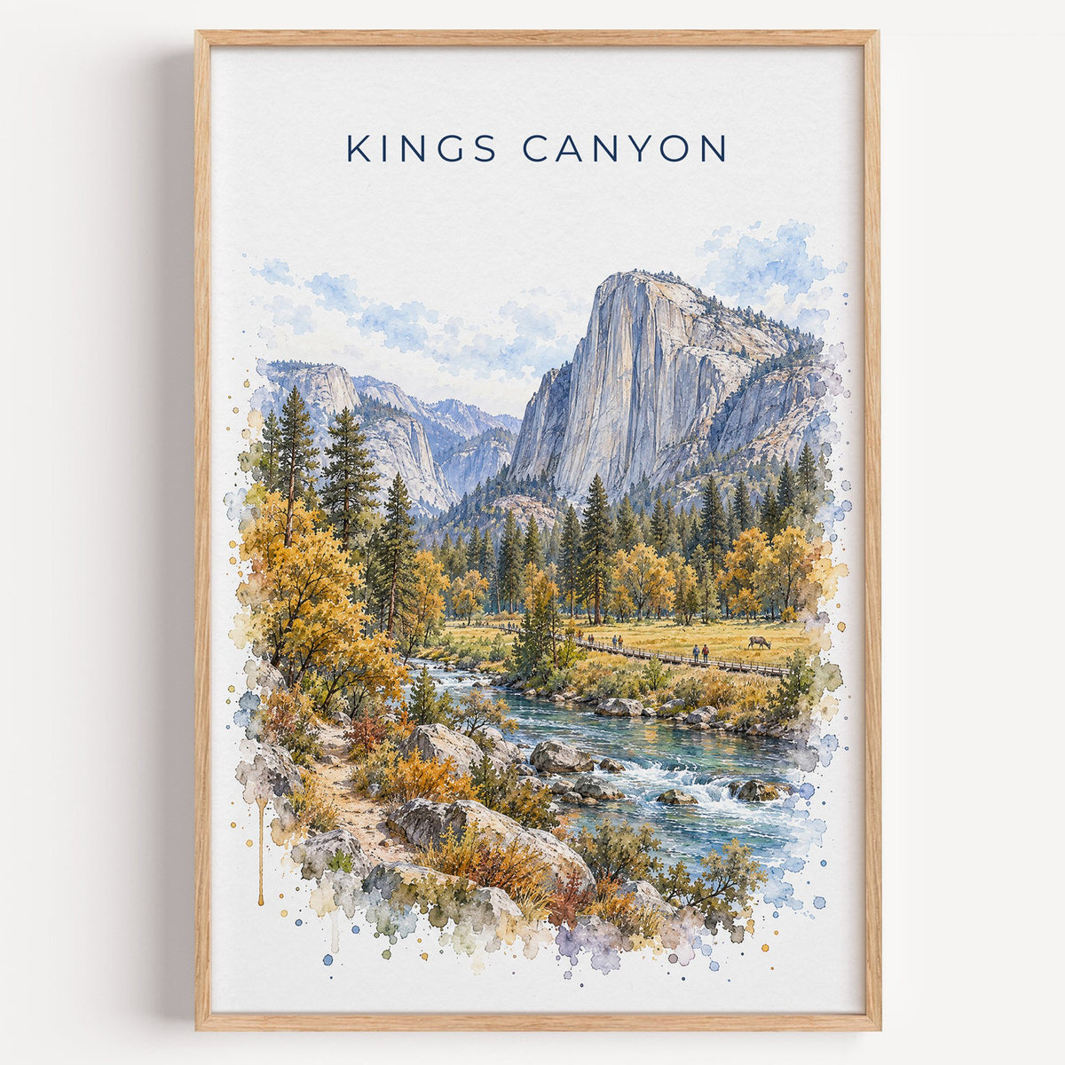 Kings Canyon National Park watercolor print in a light oak frame on a plain white wall