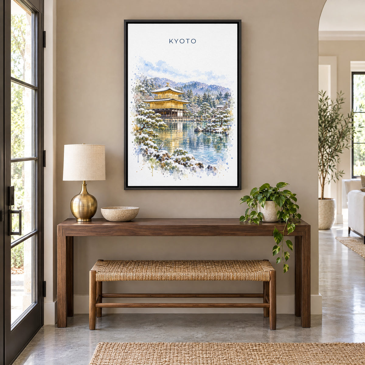 Kinkaku-ji watercolor print as a black floater canvas above a walnut console and woven bench in an entryway