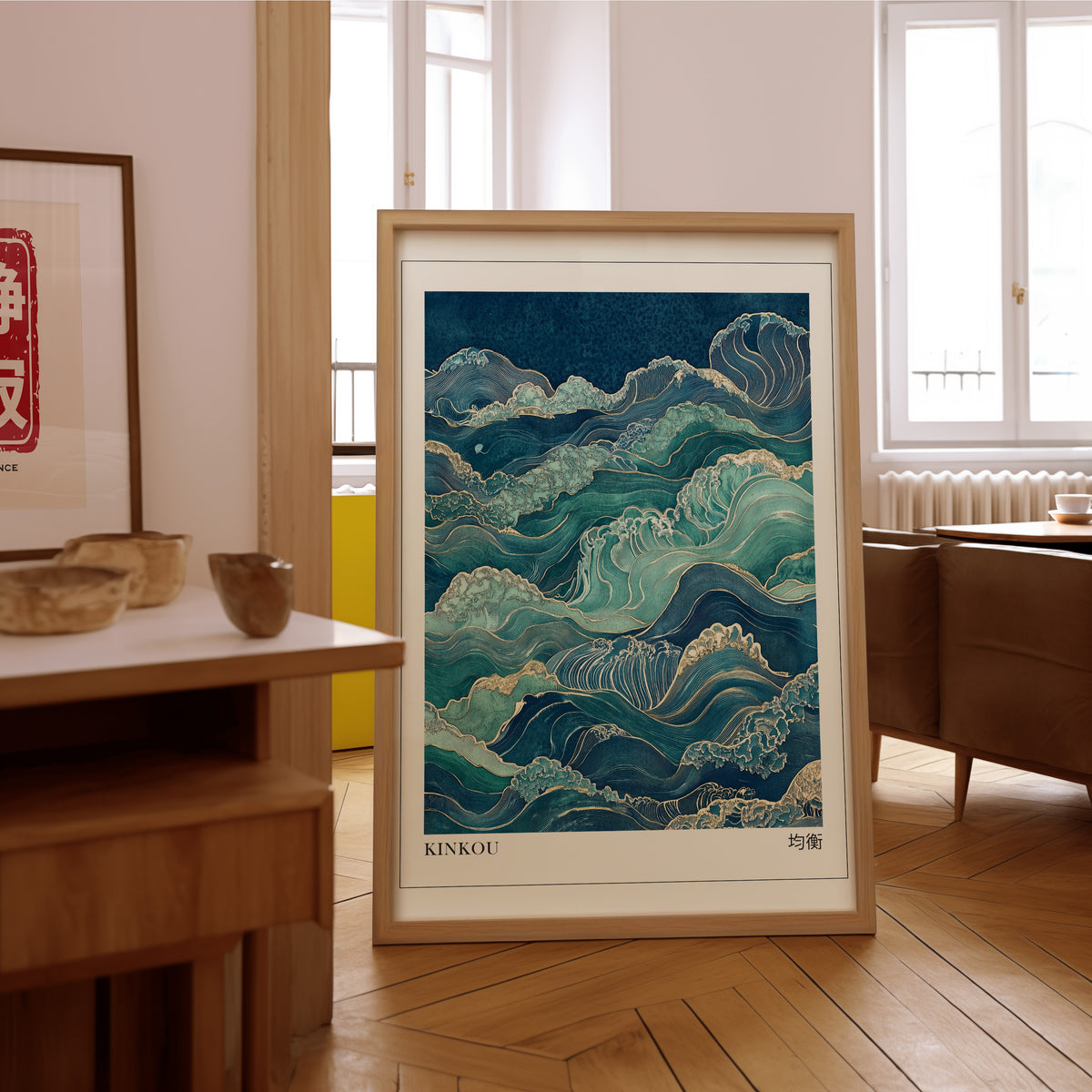 Kinkou teal and gold waves print in an oak frame on the parquet floor of a sunlit living room