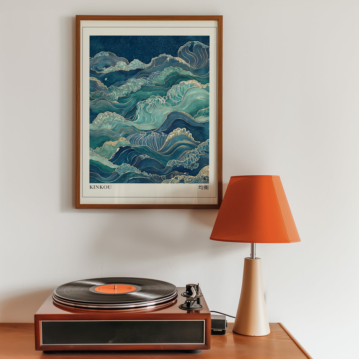 Kinkou teal and gold waves print in a walnut frame above a sideboard with a record player