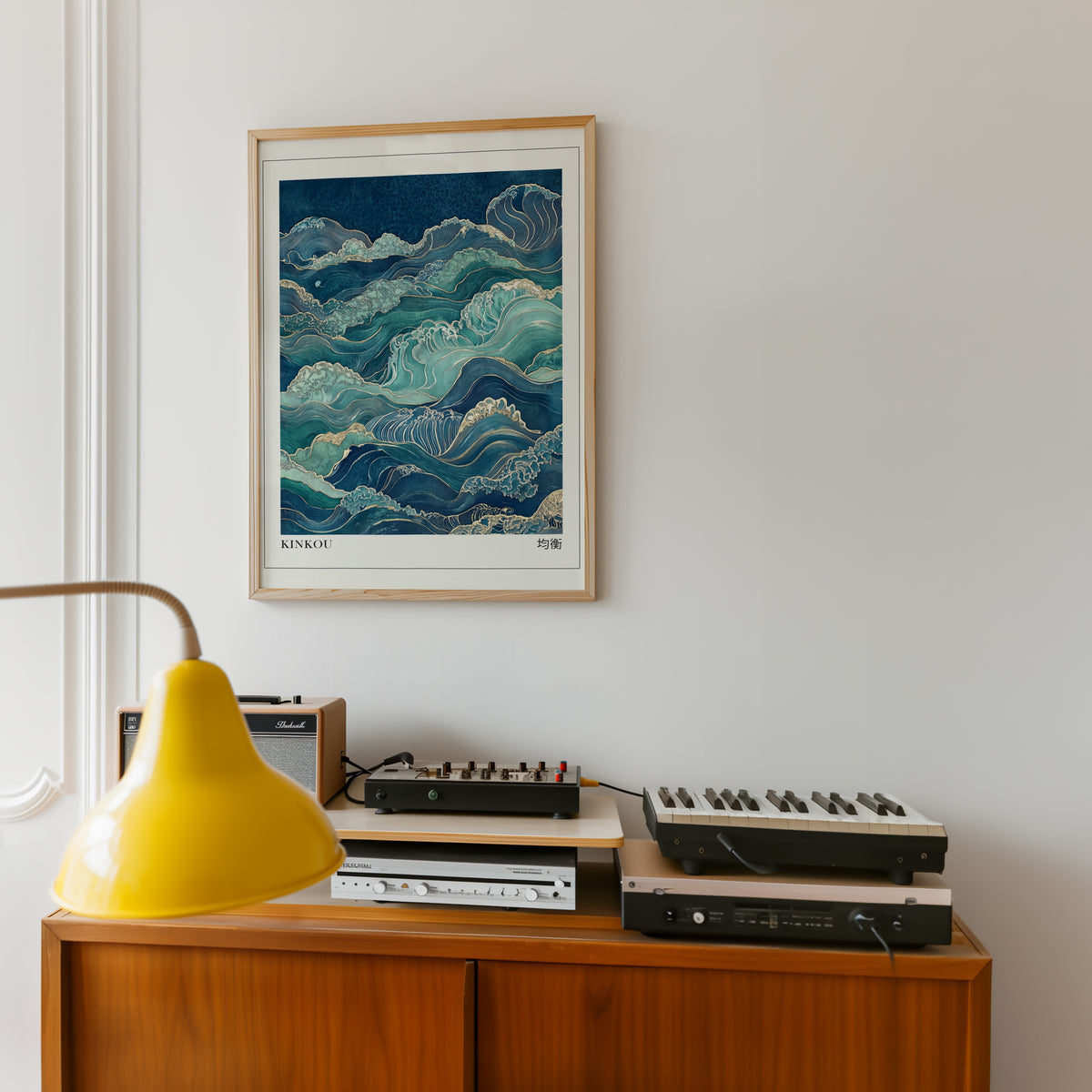 Kinkou teal and gold waves print in an oak frame above a teak sideboard with vintage hi-fi