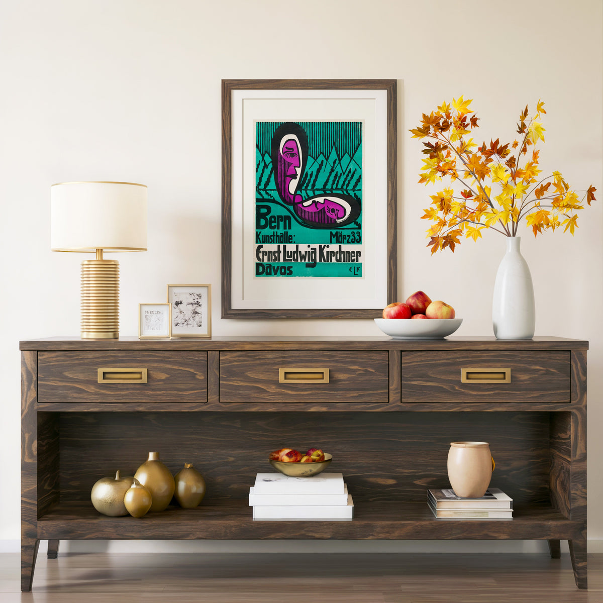 Bern Kunsthalle poster print in a walnut frame above a console with branches
