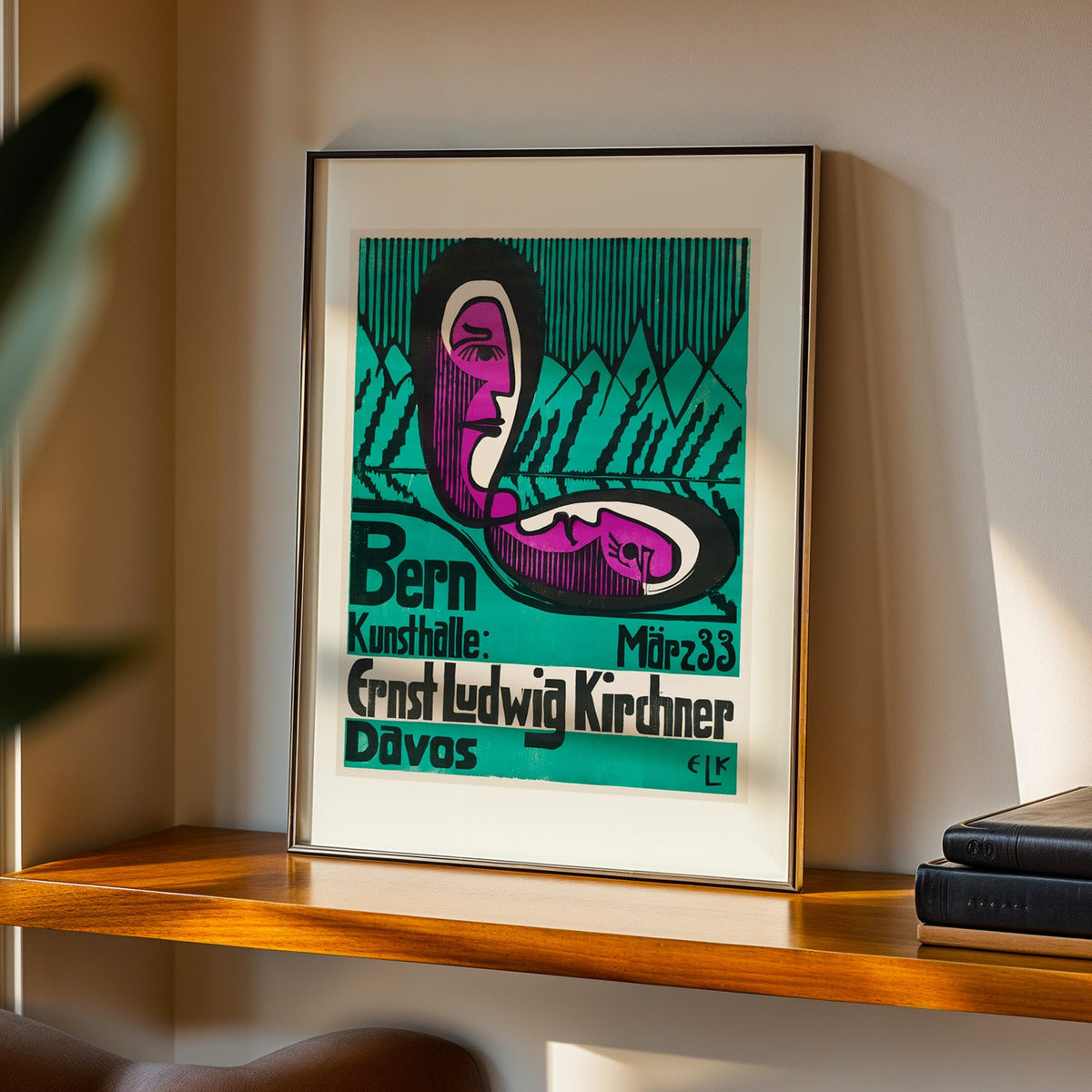 Bern Kunsthalle print in a black frame on a walnut shelf in evening light