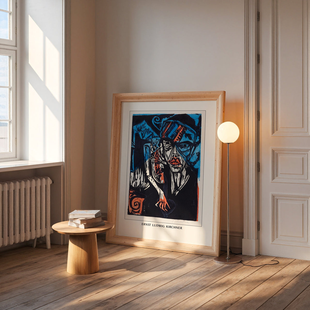 Kirchner print in a wide pine frame leaning by a sunlit window