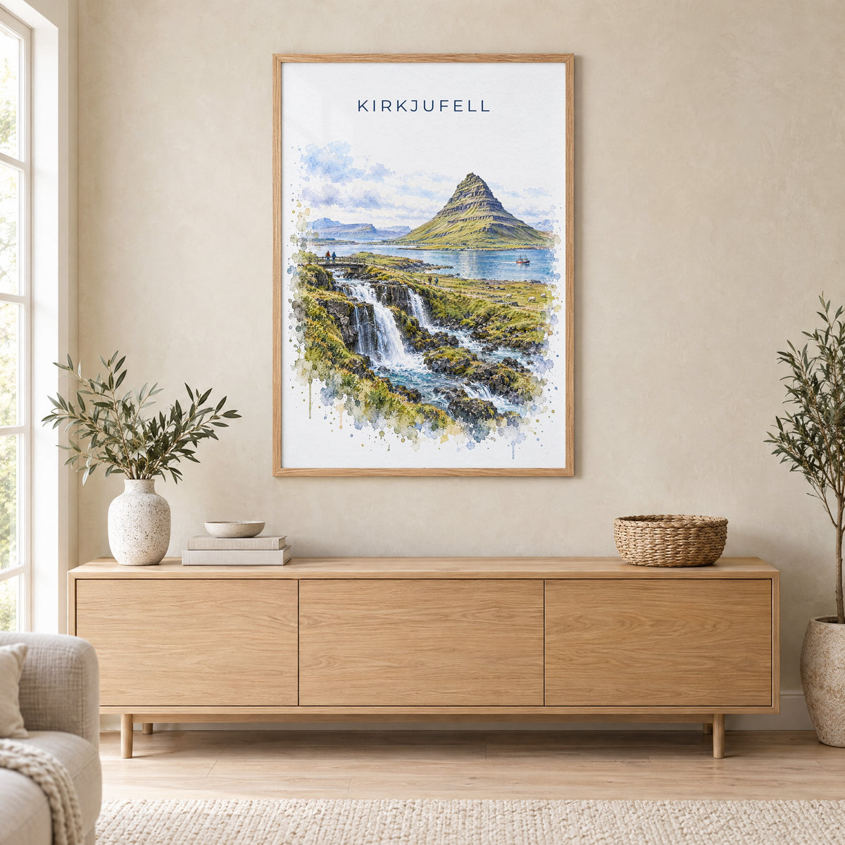 Kirkjufell watercolor print in an oak frame above a light wood sideboard in a Scandinavian living room