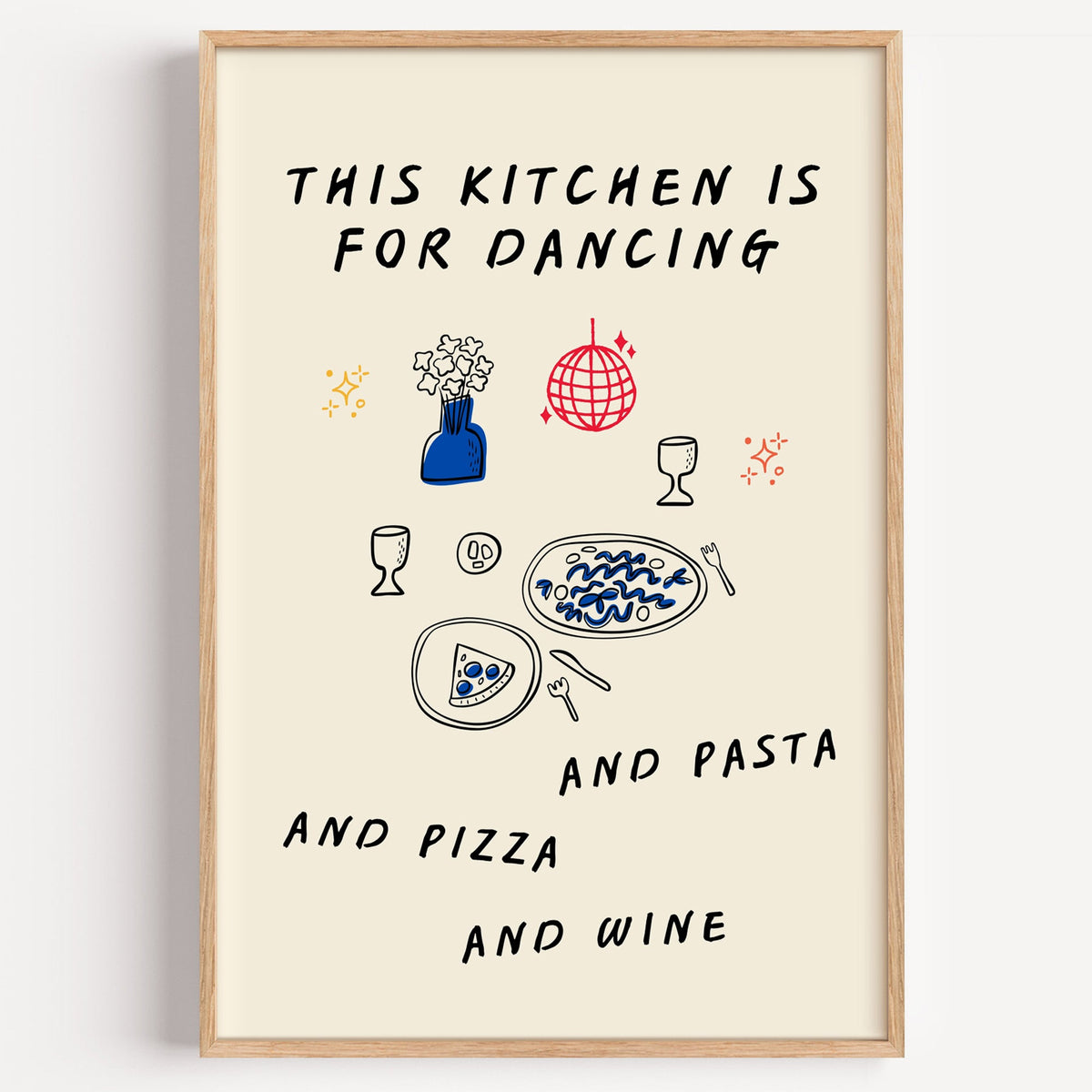 This Kitchen Is For Dancing doodle print in a light oak frame on a plain white wall