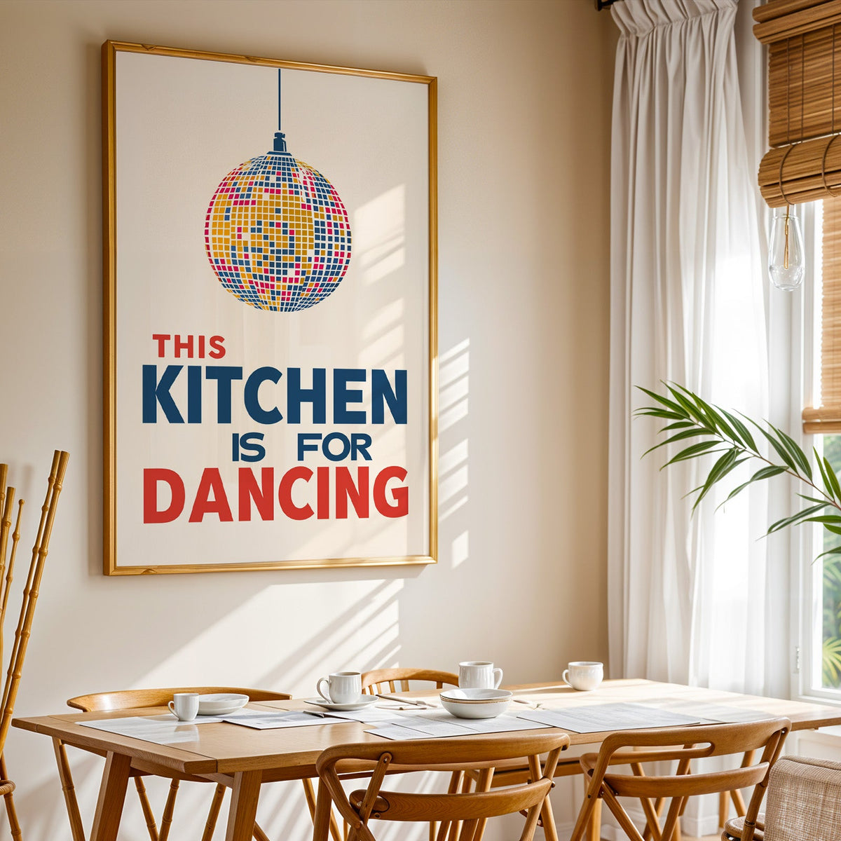 Kitchen Is For Dancing blue disco print shown in a gold frame above a breakfast table by a curtained window