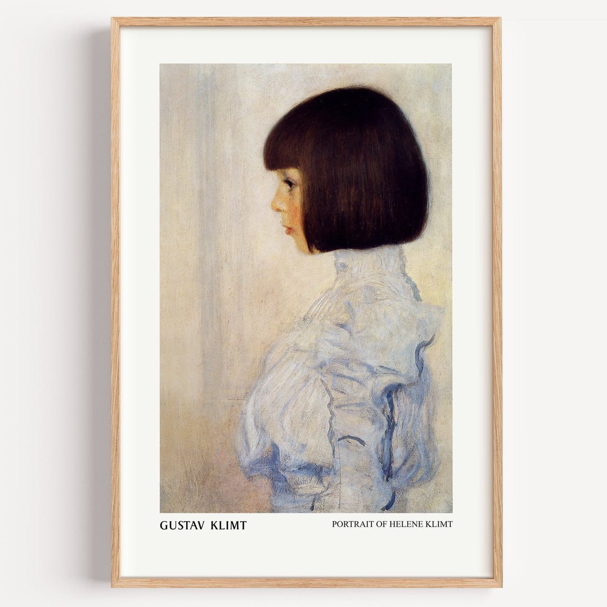 Klimt Portrait of Helene print in a light oak frame on a plain white wall