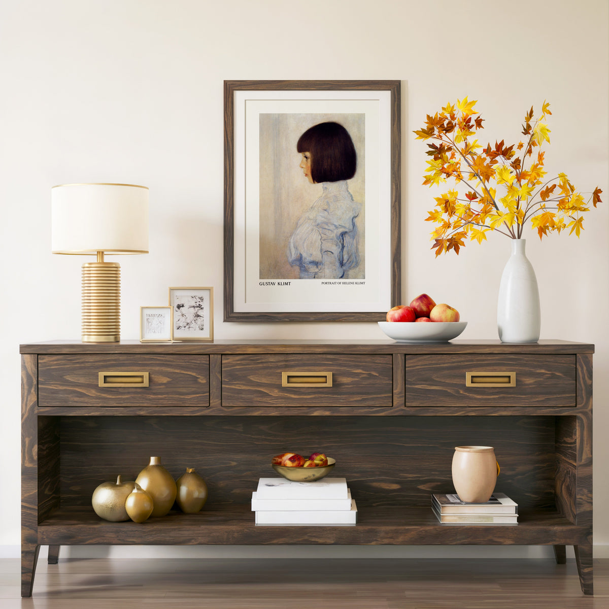 Portrait of Helene Klimt print in a walnut frame above a console with branches