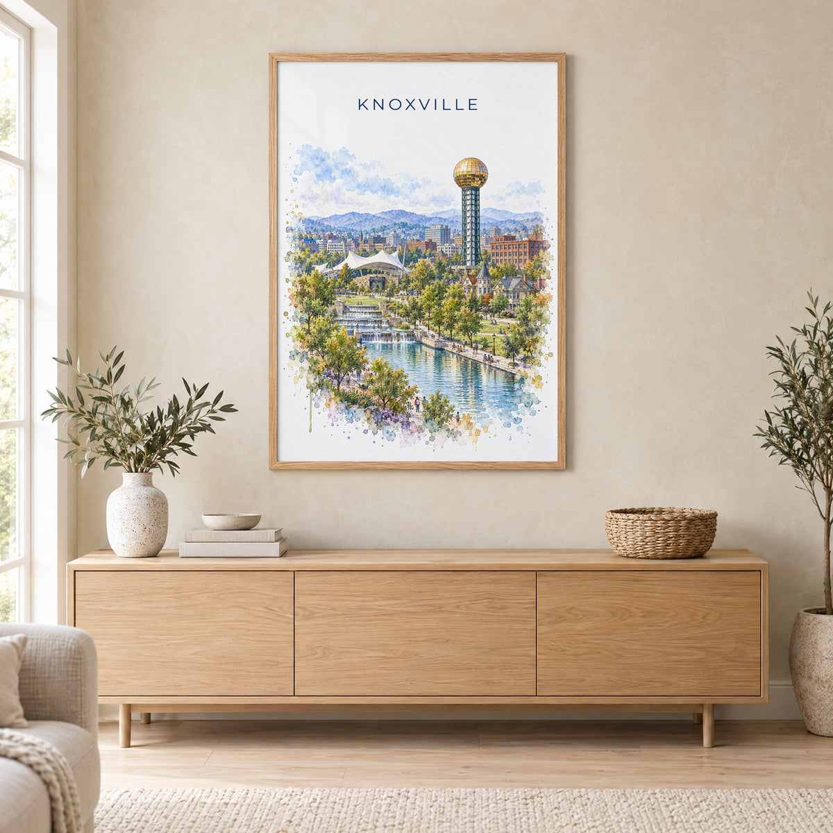 Knoxville watercolor print in an oak frame above a light wood sideboard in a Scandinavian living room