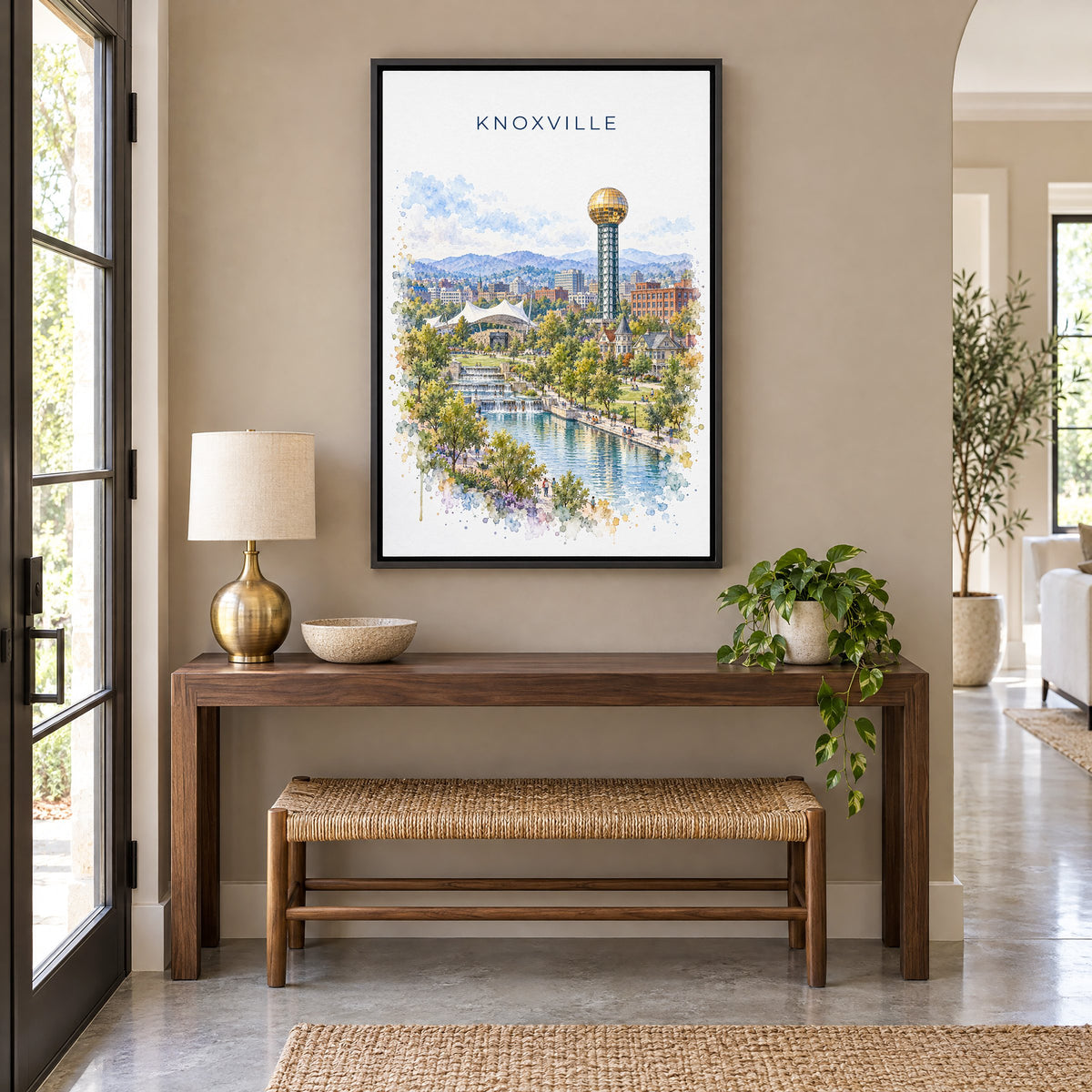 Knoxville watercolor print as a black floater canvas above a walnut console and woven bench in an entryway